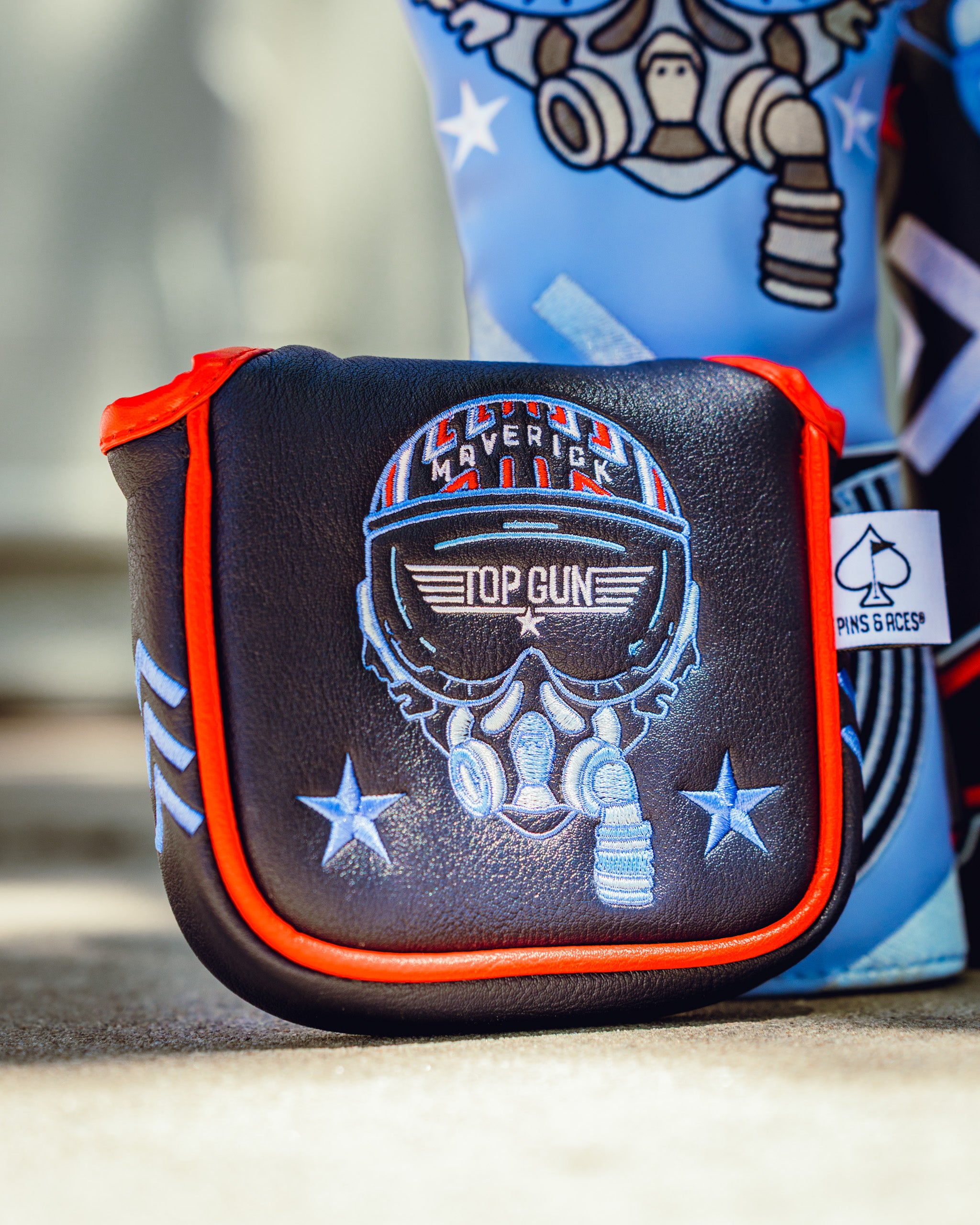 Top Gun Maverick themed golf mallet headcover with skull and aviator goggles design, featuring patriotic stars and red trim.