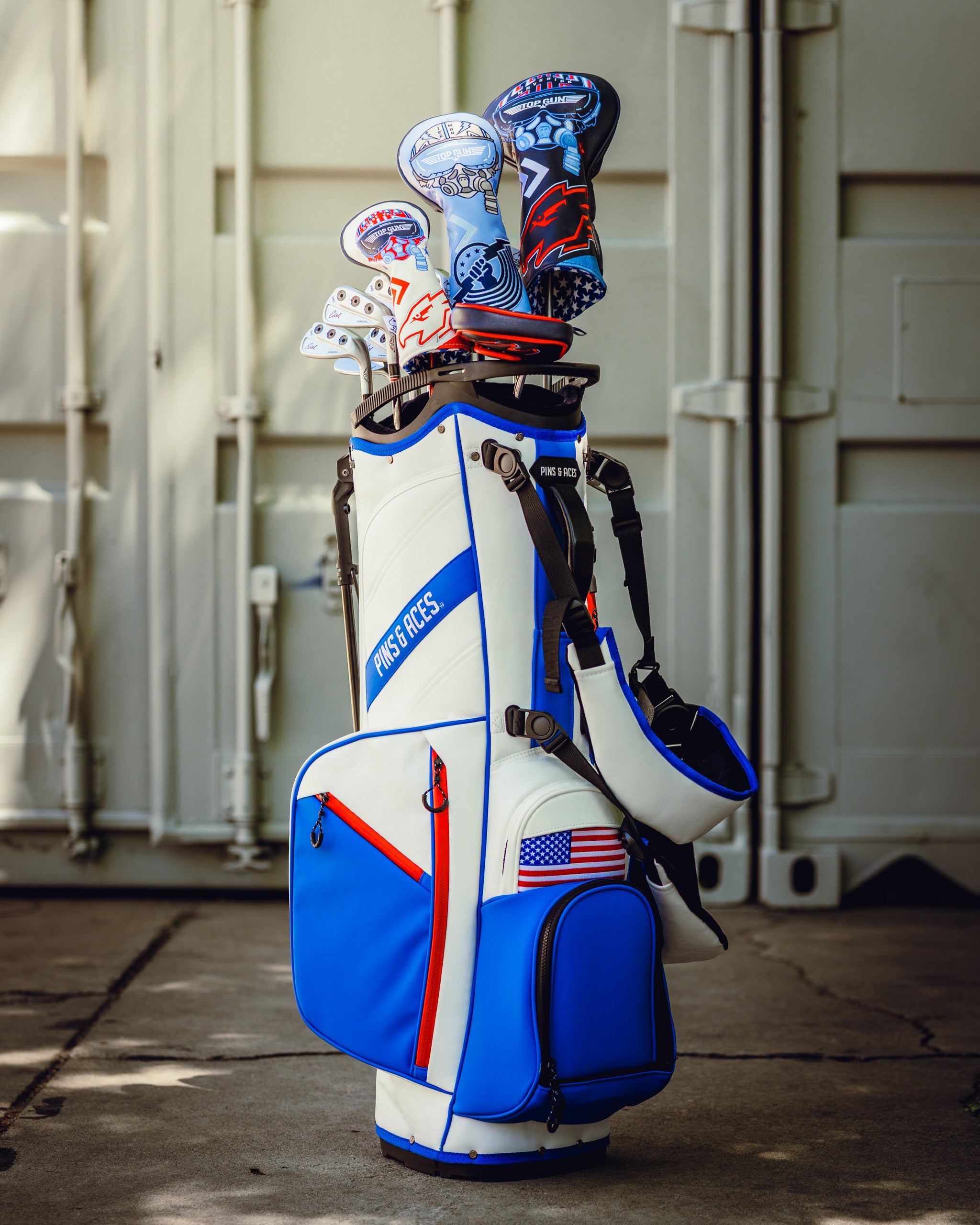 Top Gun Goose hybrid golf headcover on a golf bag with American flag design, featuring blue, white, and red colors.