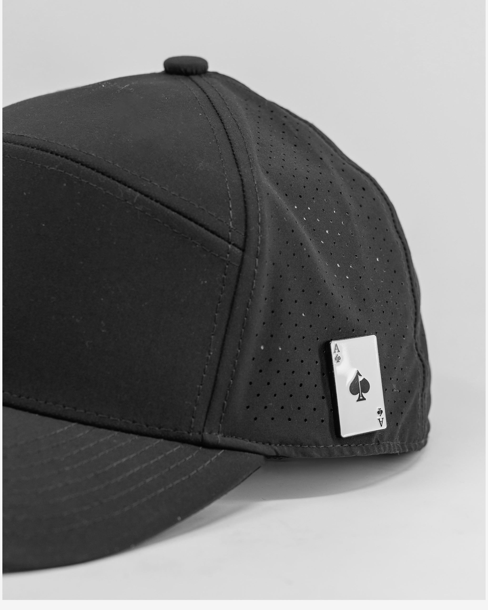 Black Tradesman hat featuring a logo and a removable ball marker.