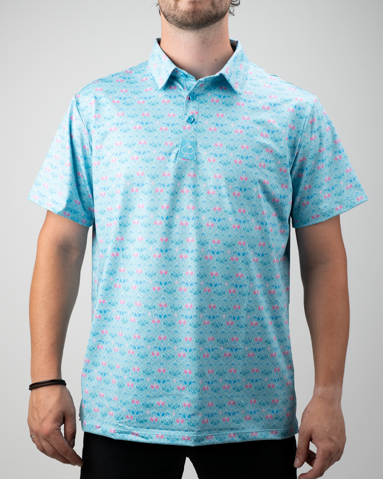 Men's Triangle Bloom golf polo shirt in light blue with a vibrant floral pattern, designed for style and comfort on the course.