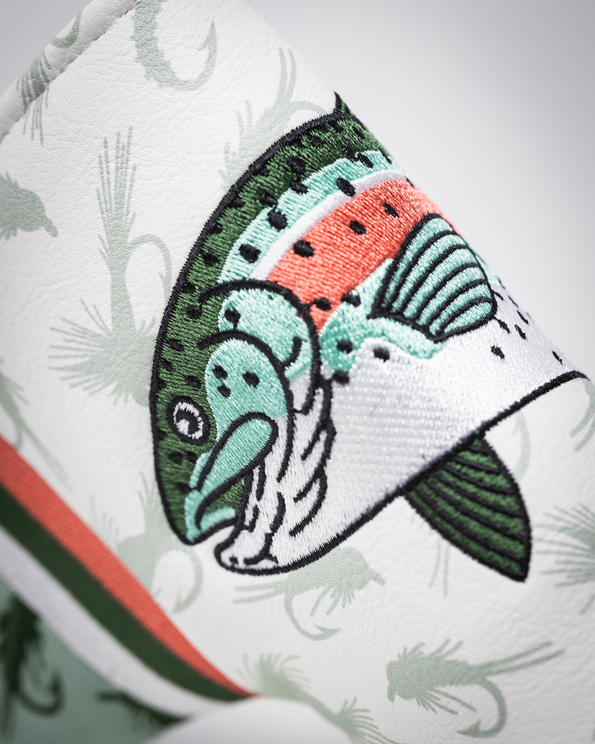 Trout Blade Putter Cover featuring a colorful trout design, made of durable material, designed to protect golf putters.