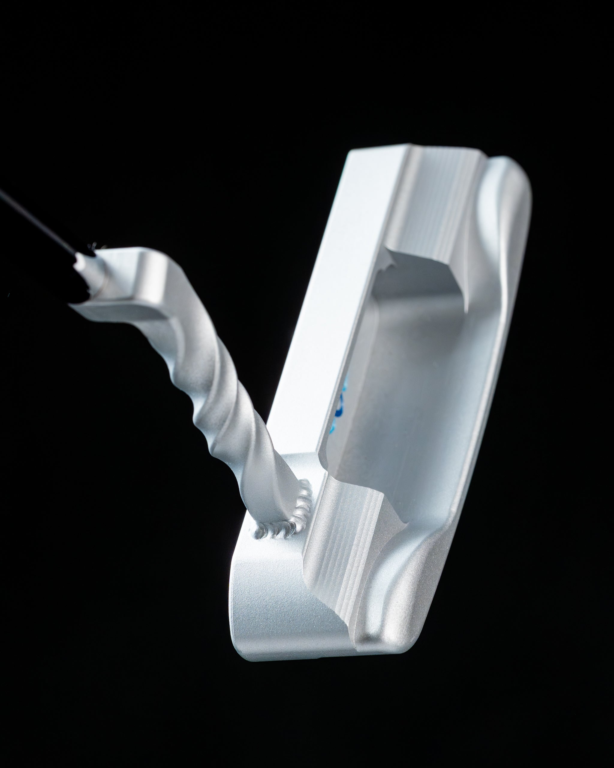 Edel Twister Putter featuring a sleek silver design and unique twisted neck for enhanced performance on the green.