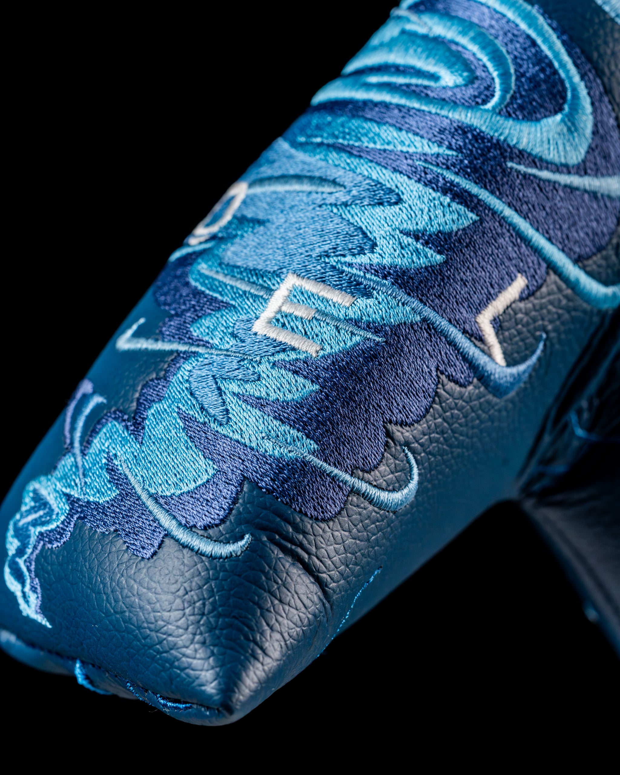 Edel Twister Putter headcover featuring intricate blue embroidery and a sleek design for stylish protection on the course.
