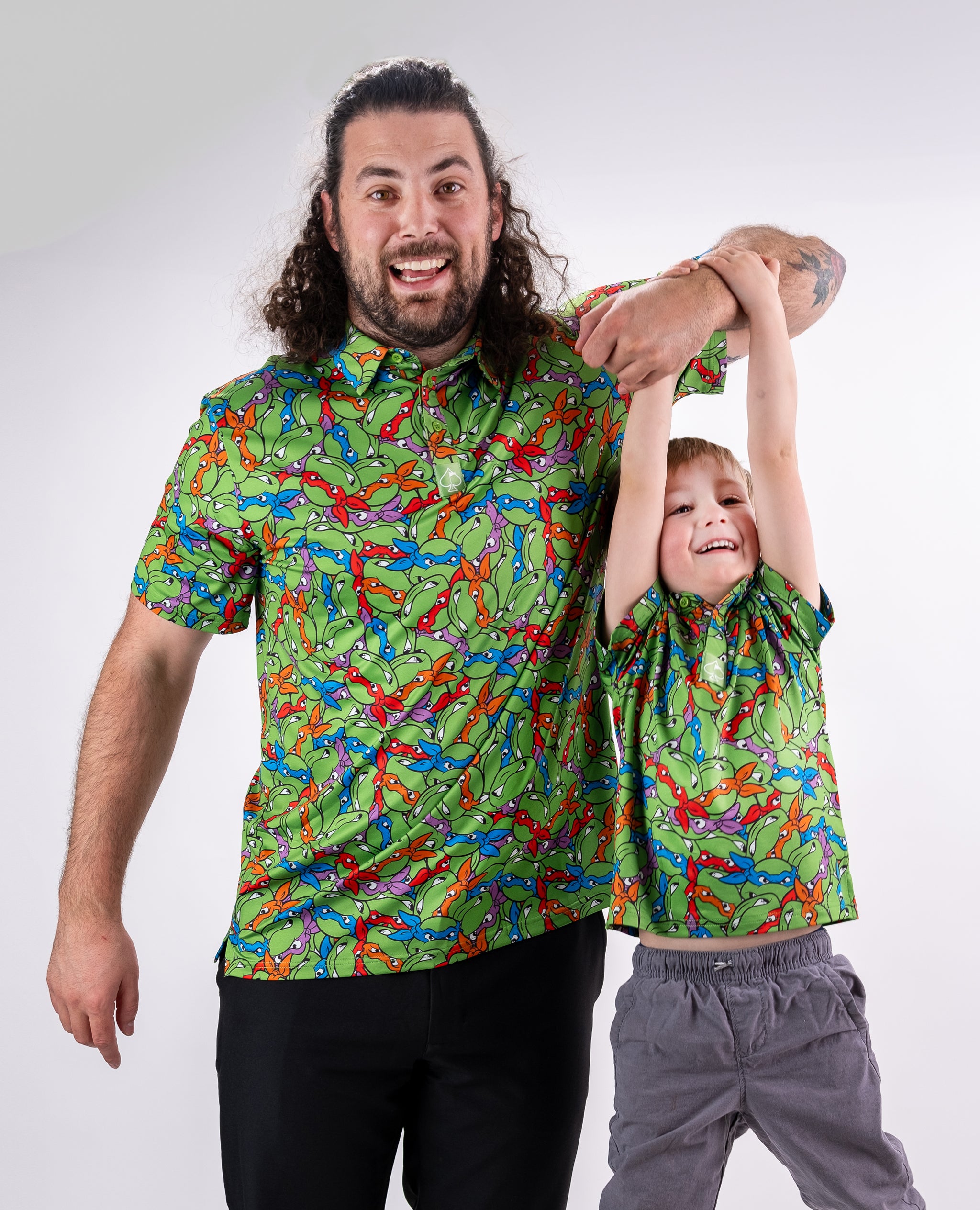 TMNT Youth Mean Green t-shirt featuring the iconic Teenage Mutant Ninja Turtles logo and colorful graphic design.