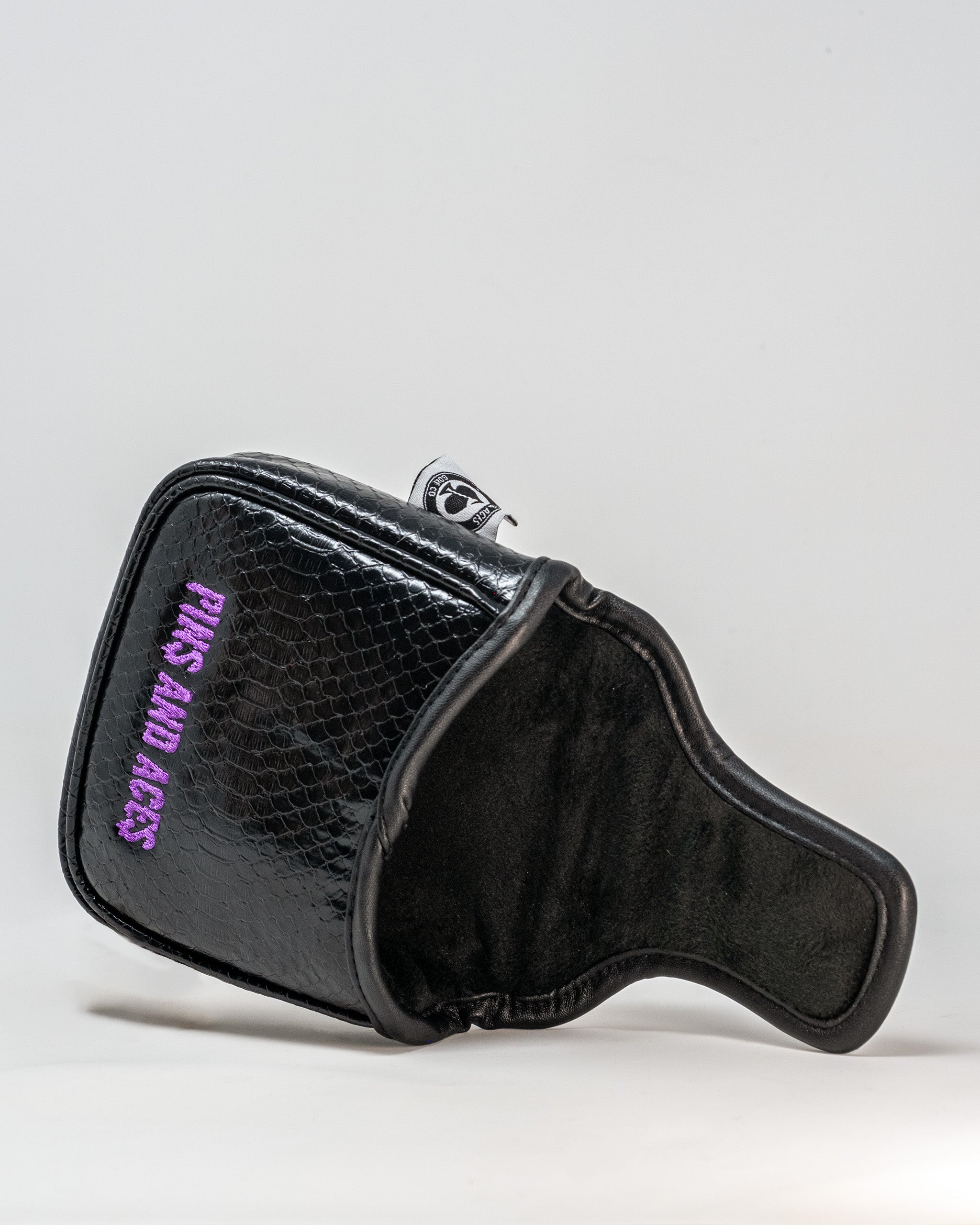 Venom mallet cover featuring a sleek black design with a striking venom logo, ideal for golf enthusiasts.