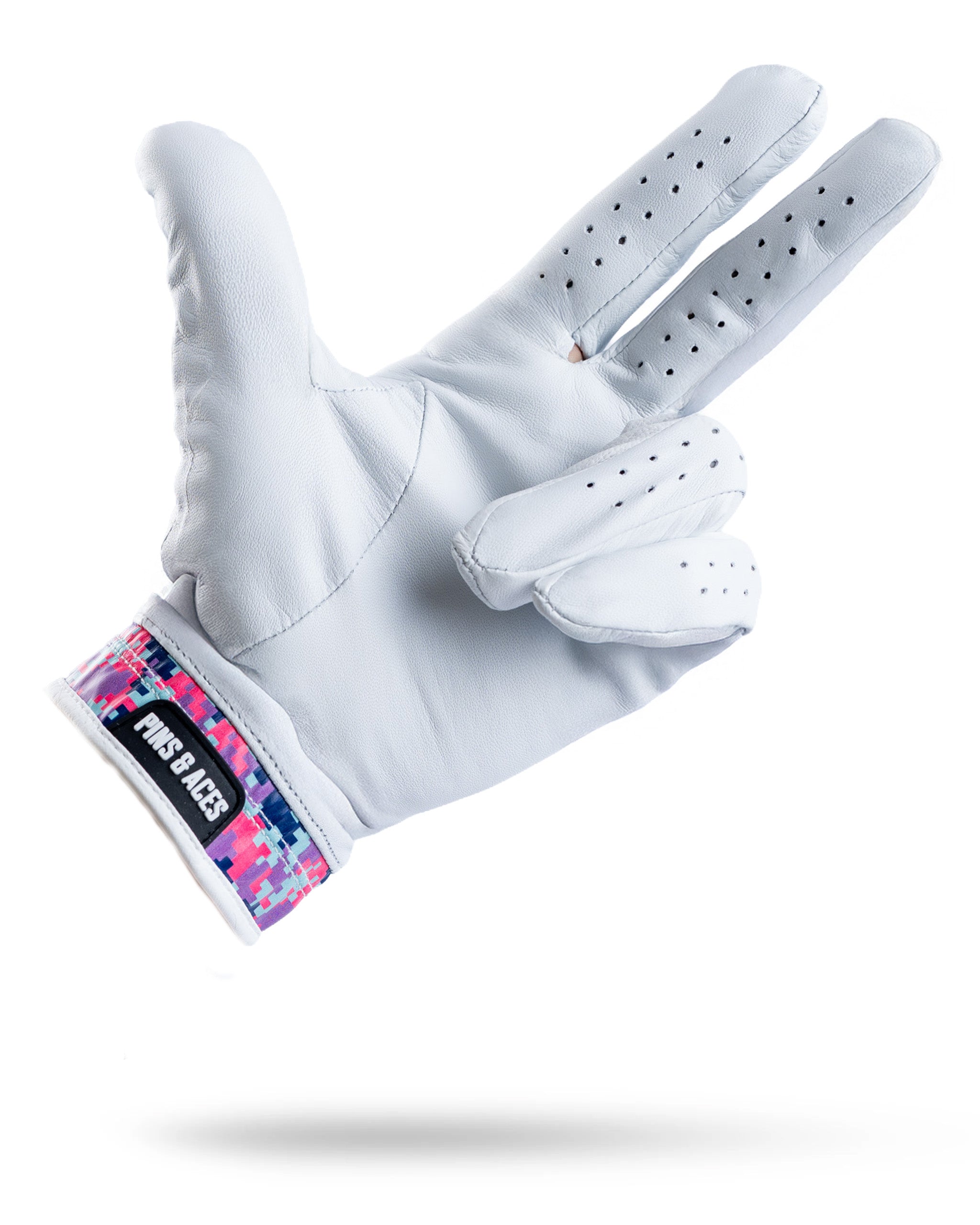Premium Tour Glove in vivid camo features a sleek white design with a colorful patterned cuff, ideal for stylish golfers.