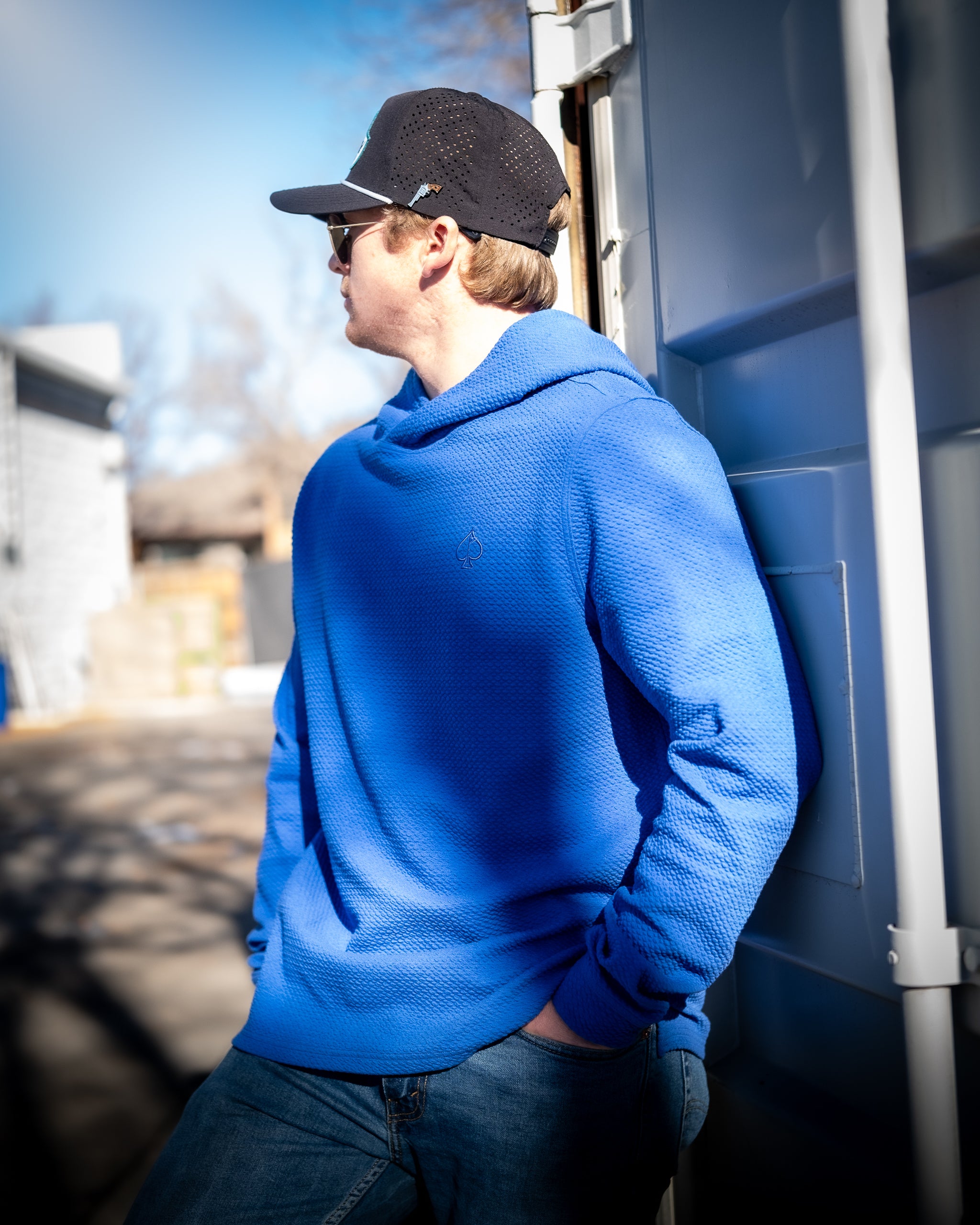 Player Preferred™ Waffle Knit Hoodie in Cobalt, featuring a textured design and casual fit, displayed in a lifestyle setting.