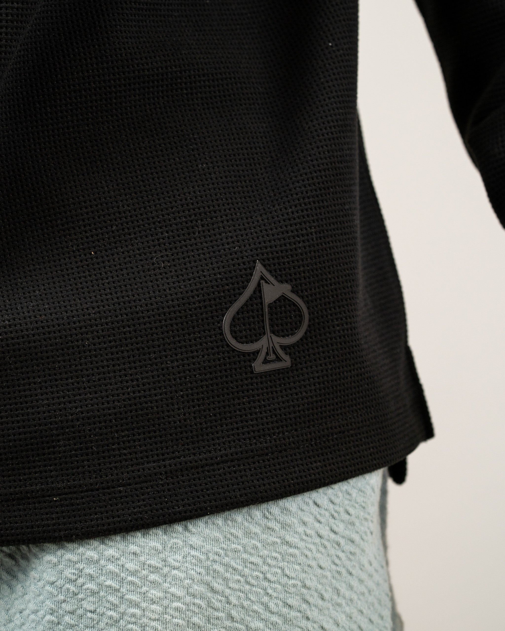 Player Preferred Waffle Grid Hoodie in Obsidian features a textured black fabric with a subtle spade logo on the side.