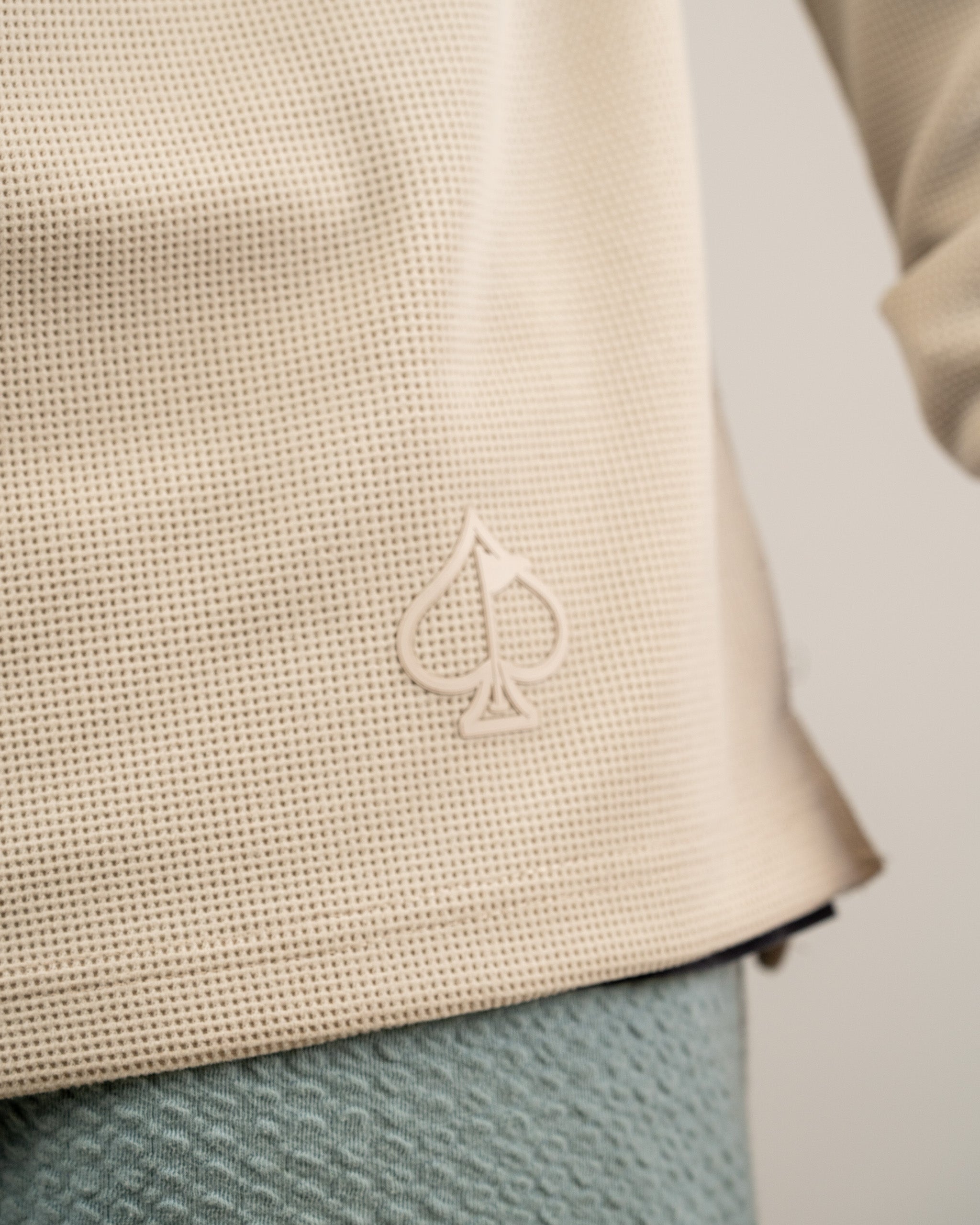 Player Preferred Waffle Grid Hoodie in Dark Stone featuring a textured fabric and spade logo detail. Ideal for stylish golfers.