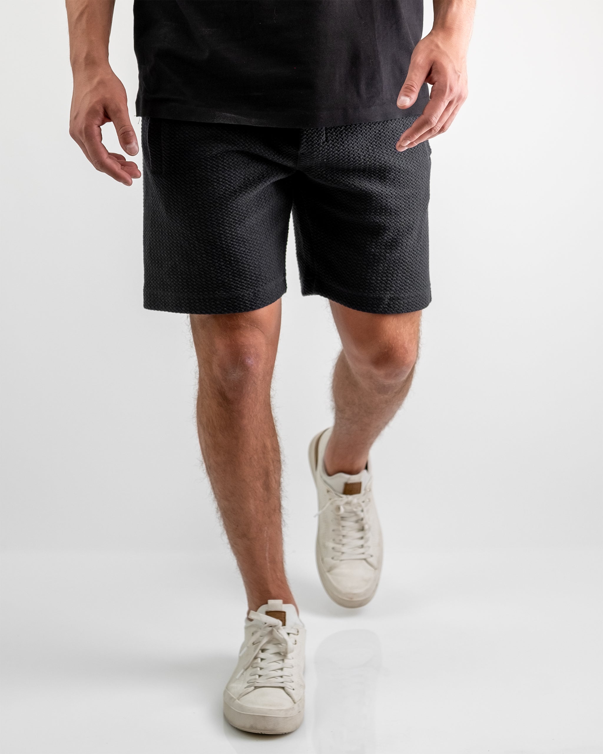Player Preferred™ Waffleknit Shorts in Obsidian, featuring a textured fabric and an elastic waistband for comfort.