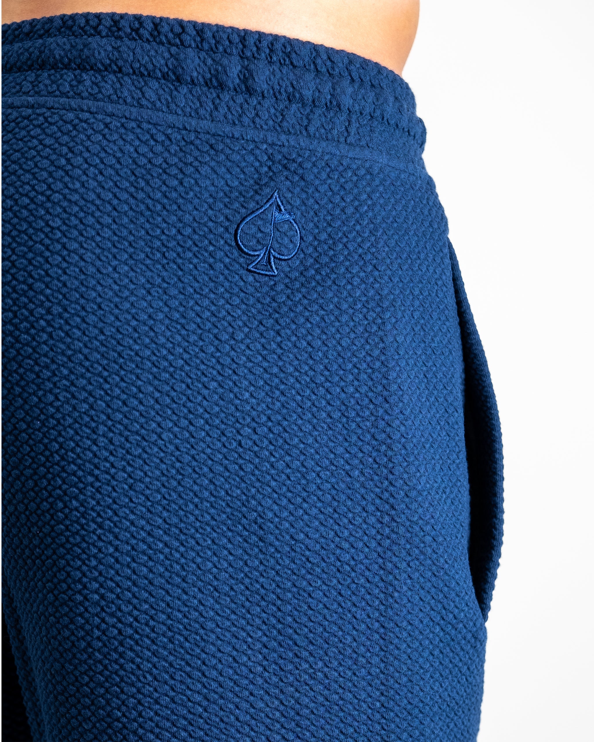 Player Preferred™ Waffleknit Shorts in Admiral blue, featuring a textured fabric and elastic waistband, displayed against a neutral background.