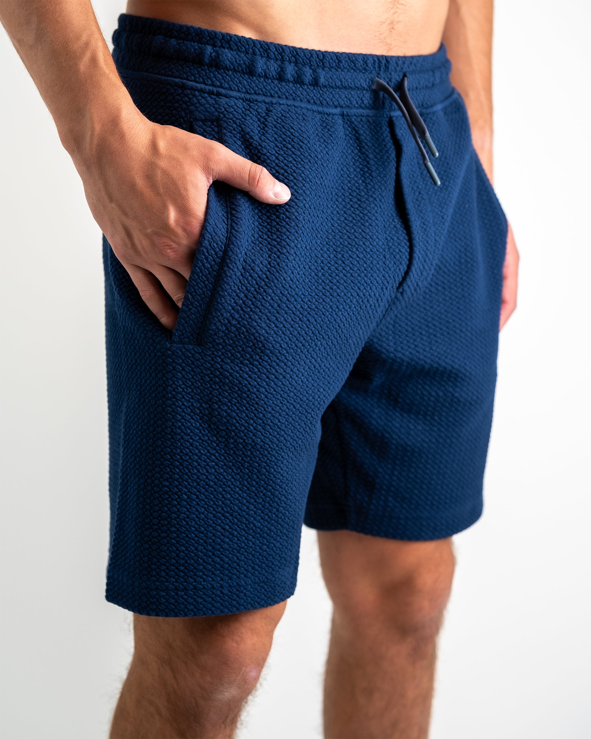 Player Preferred™ Waffleknit Shorts in Admiral blue, featuring an elastic waistband and textured fabric.