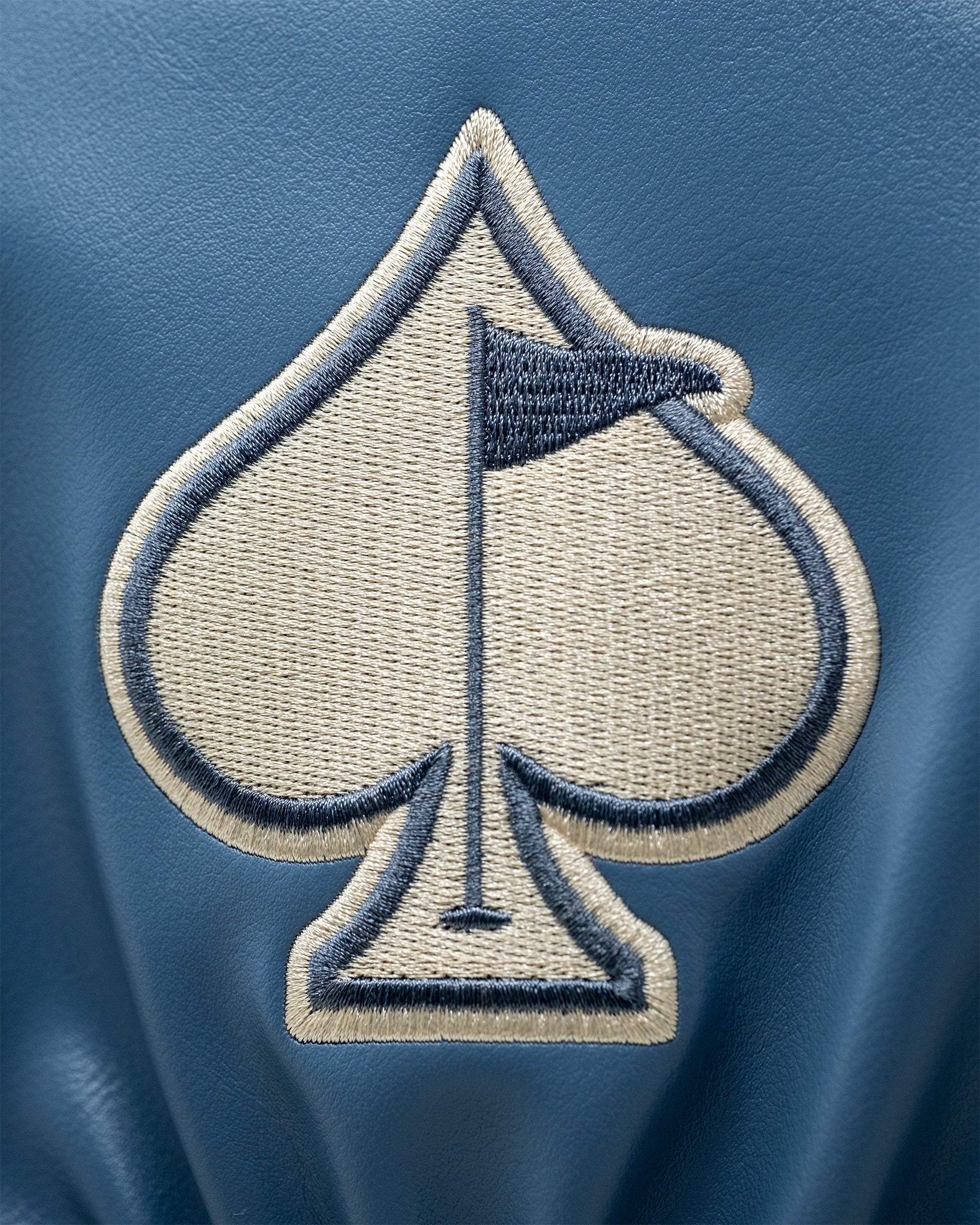 Western aesthetic driver cover featuring a rustic design with a cowboy motif and decorative stitching.