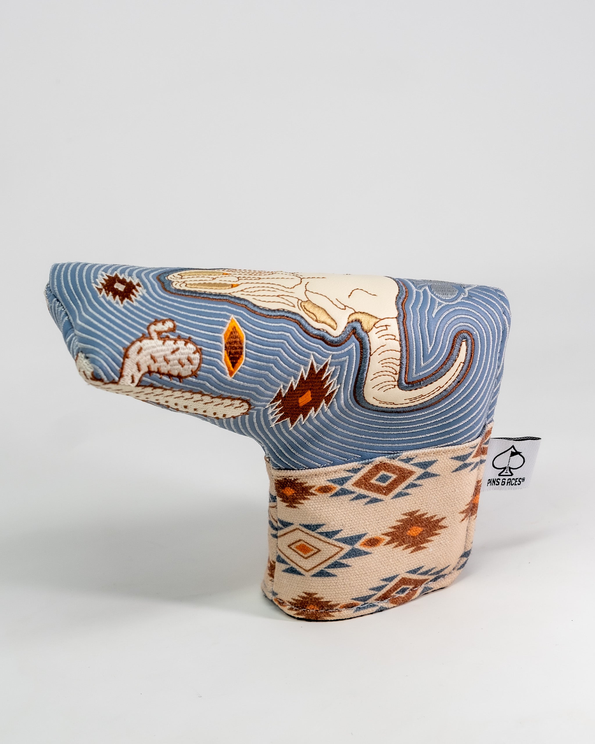 Western aesthetic blade putter cover with a southwestern-inspired design featuring geometric patterns and earthy tones.
