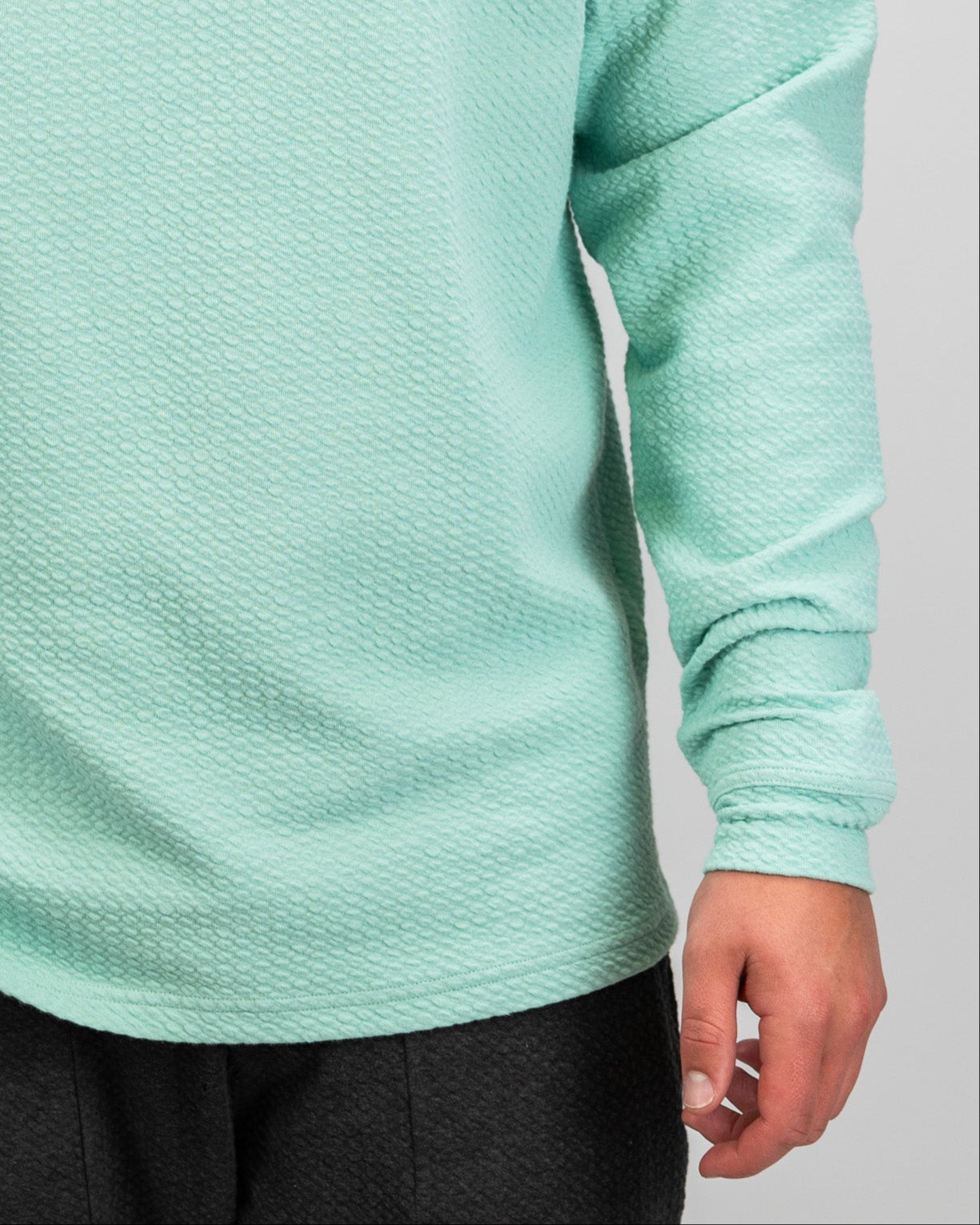 Bright mint Player Preferred™ waffle knit hoodie featuring a relaxed fit and textured fabric.