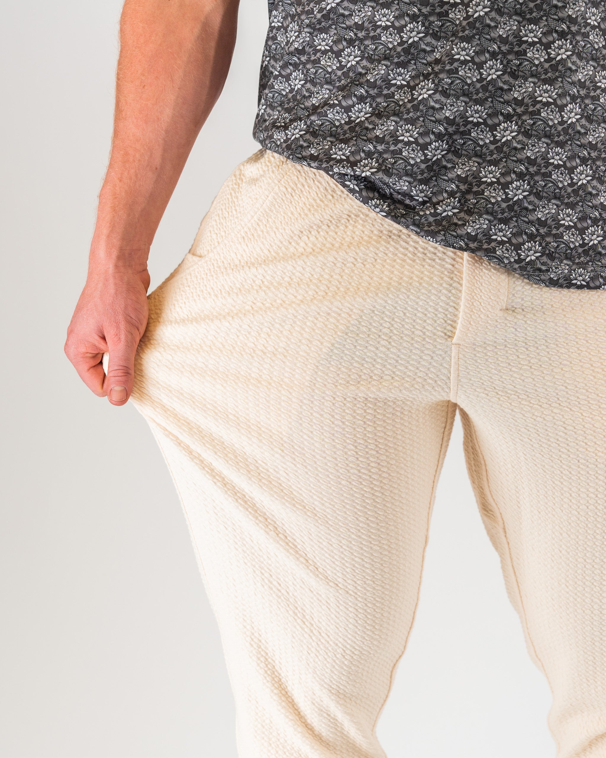Cream waffle knit jogger, featuring a comfortable elastic waistband and ribbed cuffs, displayed on a neutral background.