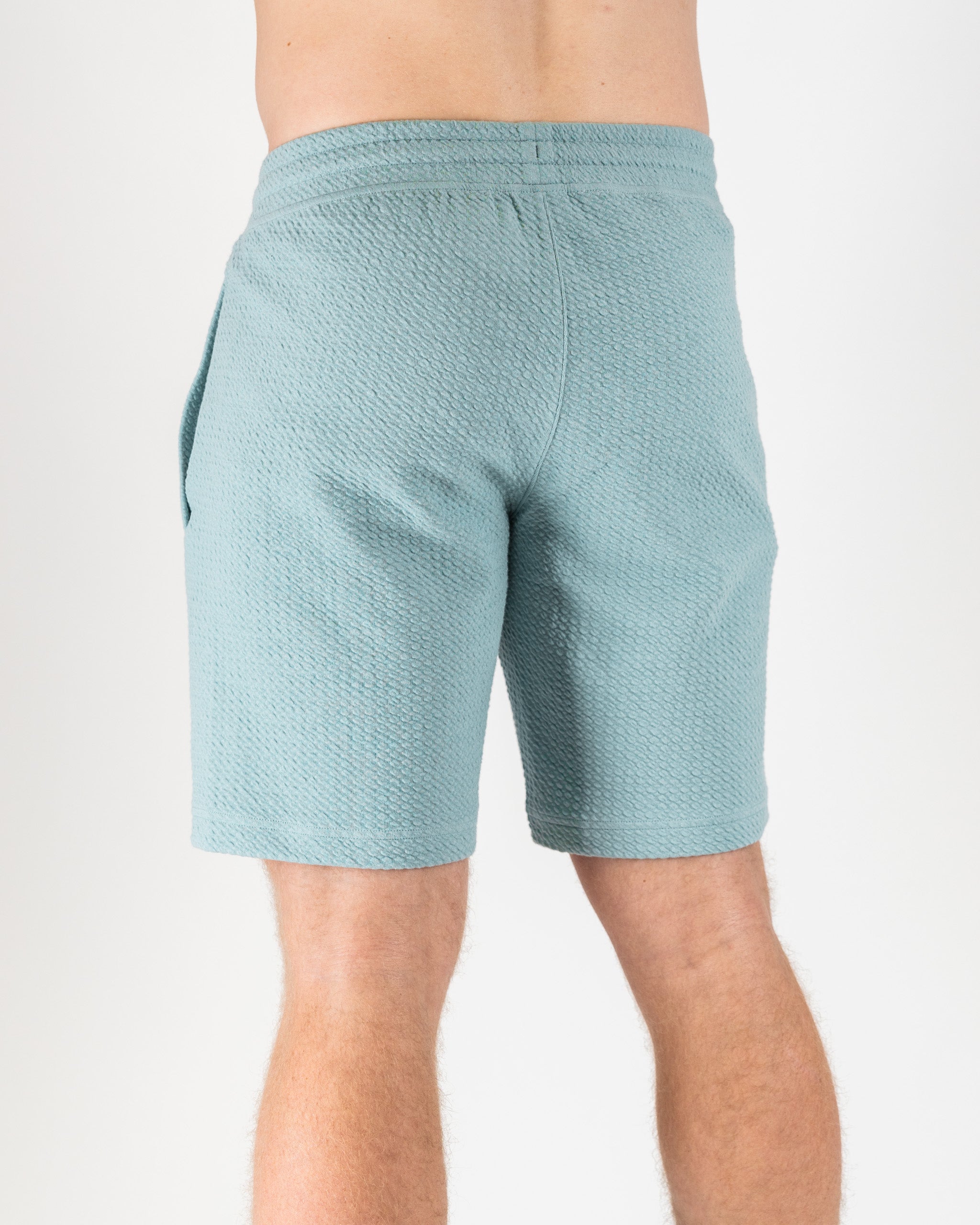 Player Preferred™ waffle knit shorts in blue gray, featuring a soft texture and an elastic waistband for comfort.
