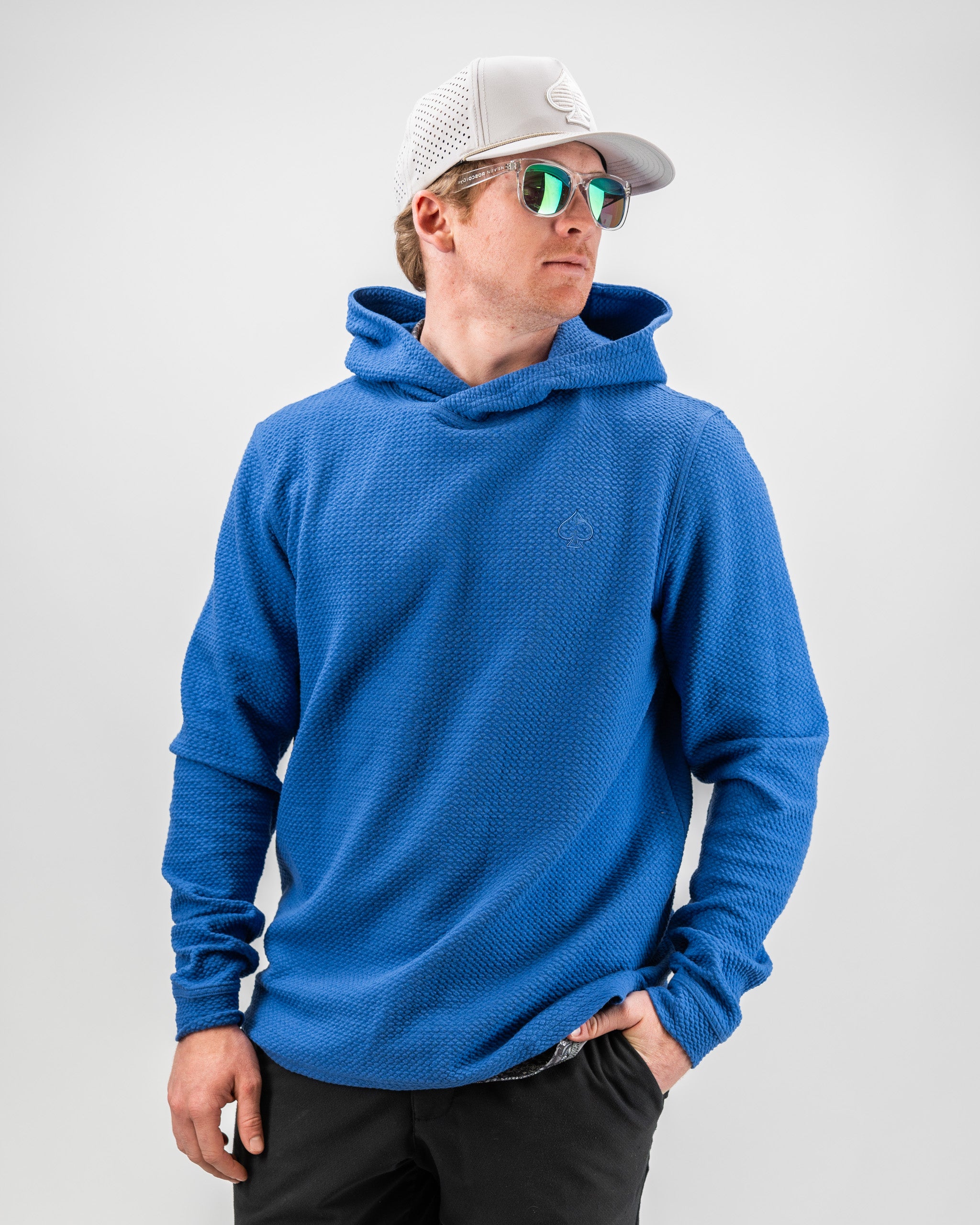 Alt text: Cobalt Player Preferred™ Waffle Knit Hoodie displayed on a hanger, featuring a cozy design and textured fabric, ideal for winter wear.