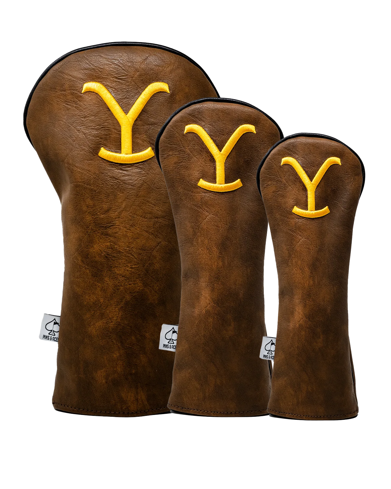 Yellowstone headcover set featuring three brown leather covers with a bold yellow 'Y' logo, designed for golf clubs.
