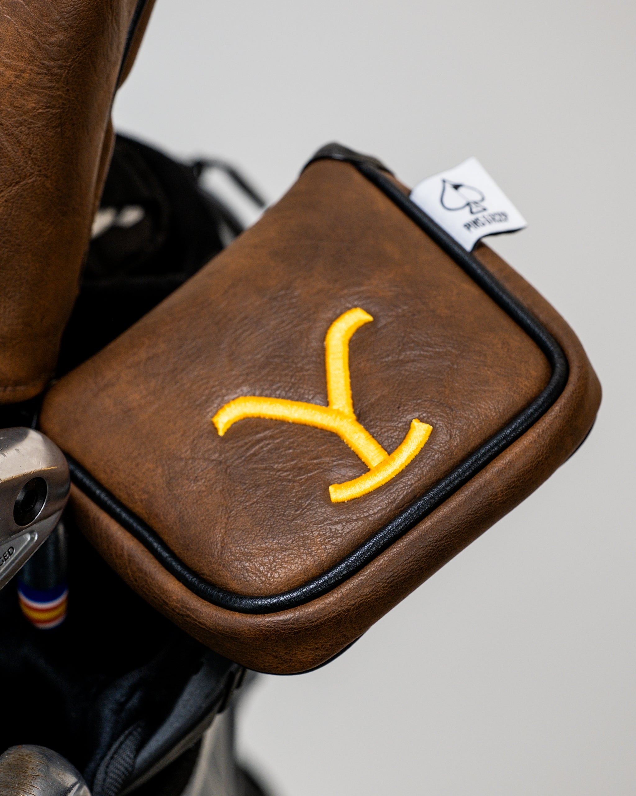 Yellowstone mallet putter cover featuring a rugged design with a scenic mountain and forest landscape.