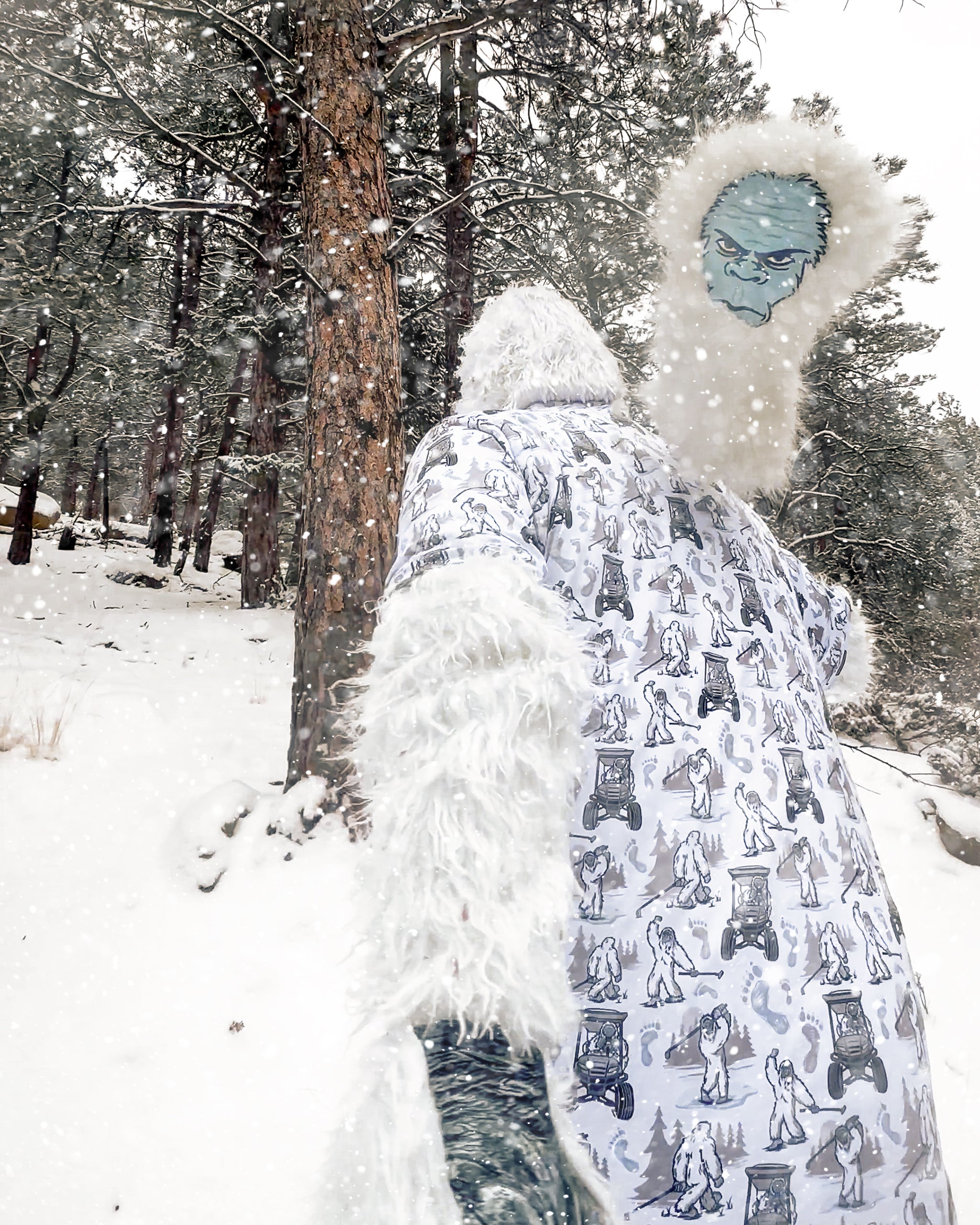 Snowy forest scene with person in a white, patterned golf robe and a monster headcover featuring a blue face and fluffy wh...