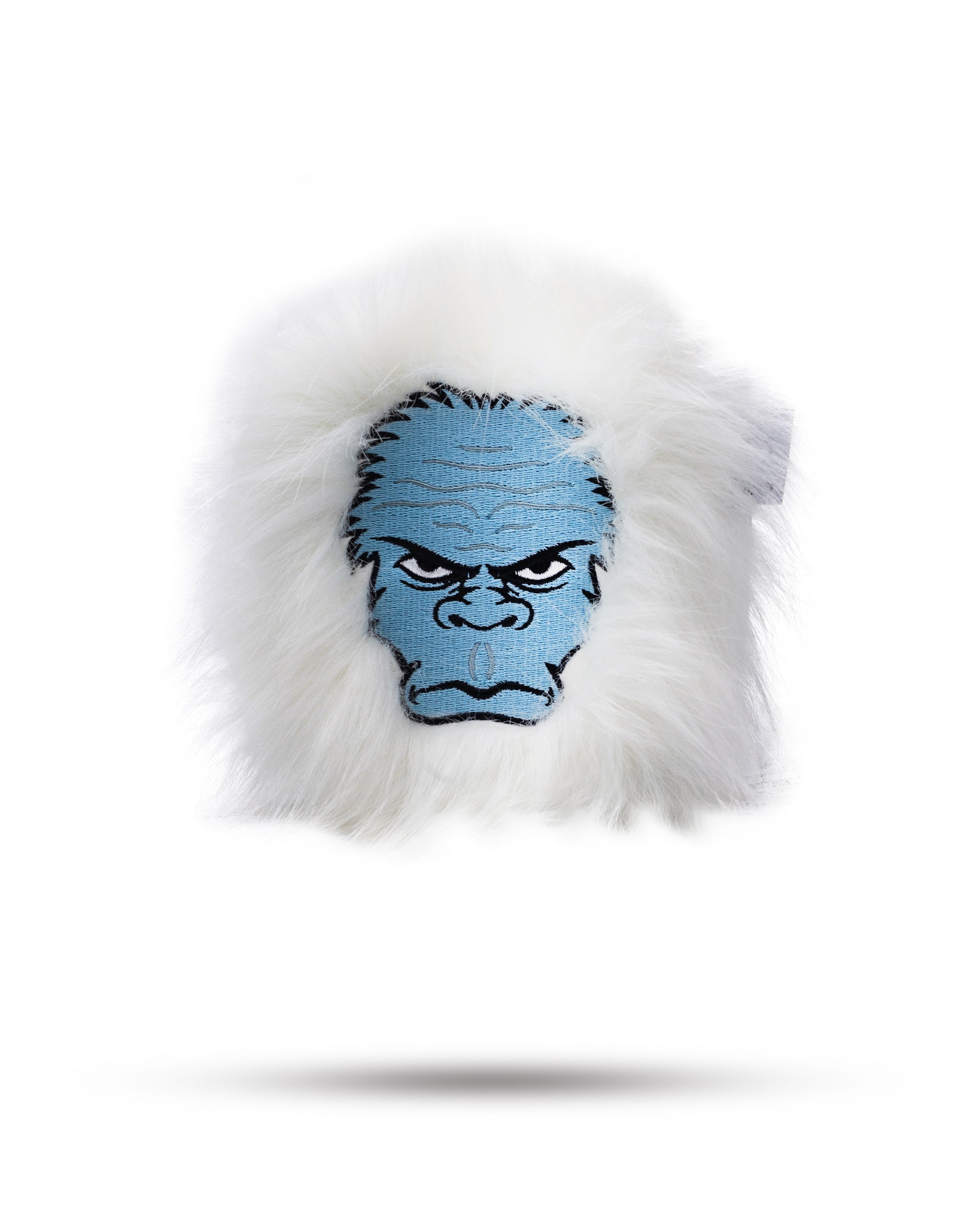 Yeti mallet golf putter cover in black with white logo and furry interior, displayed on a wooden surface.