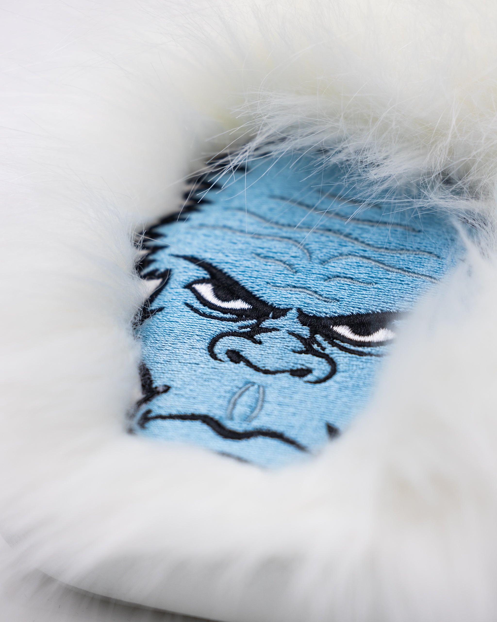 Yeti Mallet Cover, featuring a durable design with the Yeti logo and a vibrant color scheme.