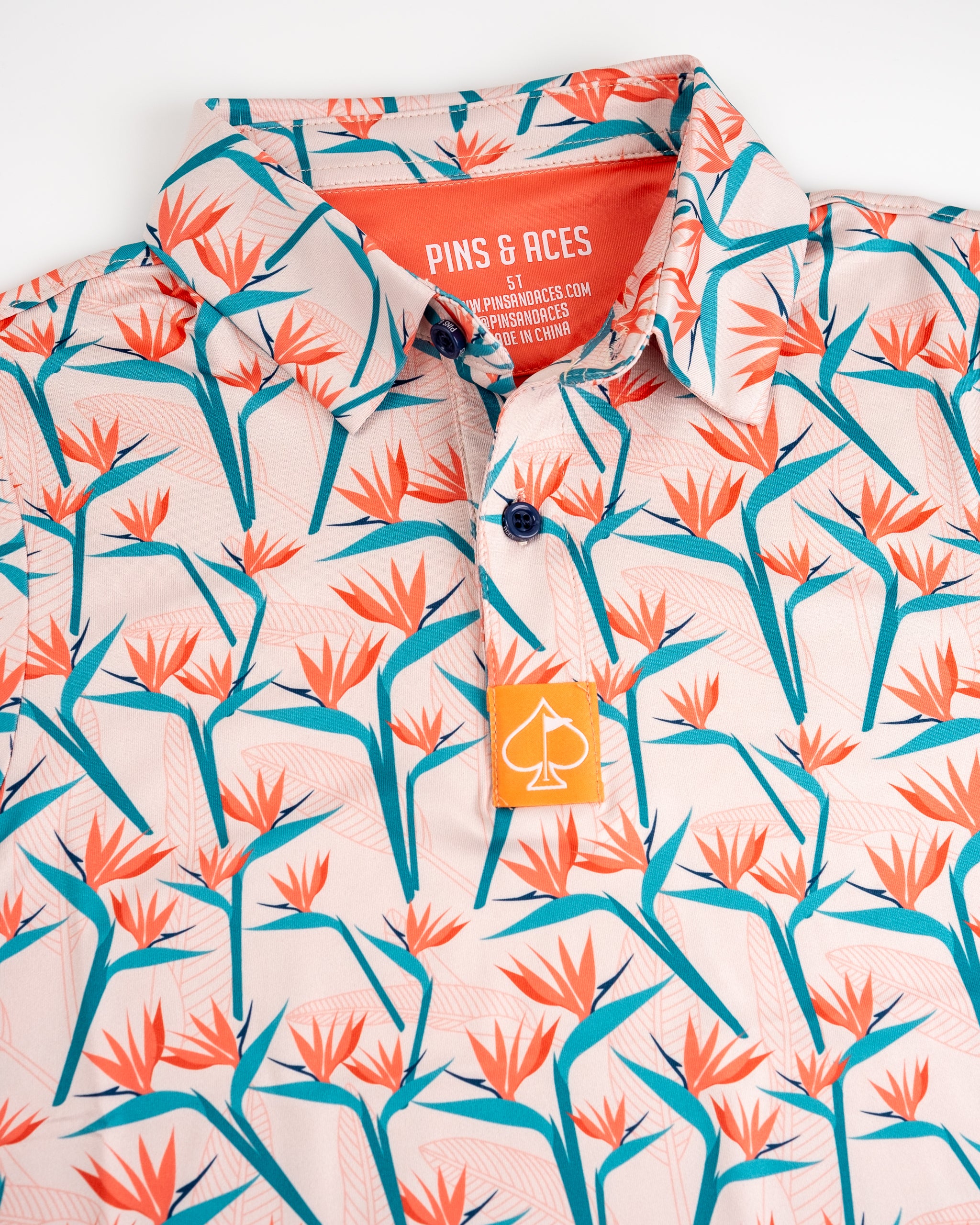 Youth Birds of Paradise, colorful tropical bird print on fabric, featuring vibrant hues of blue, green, and orange.