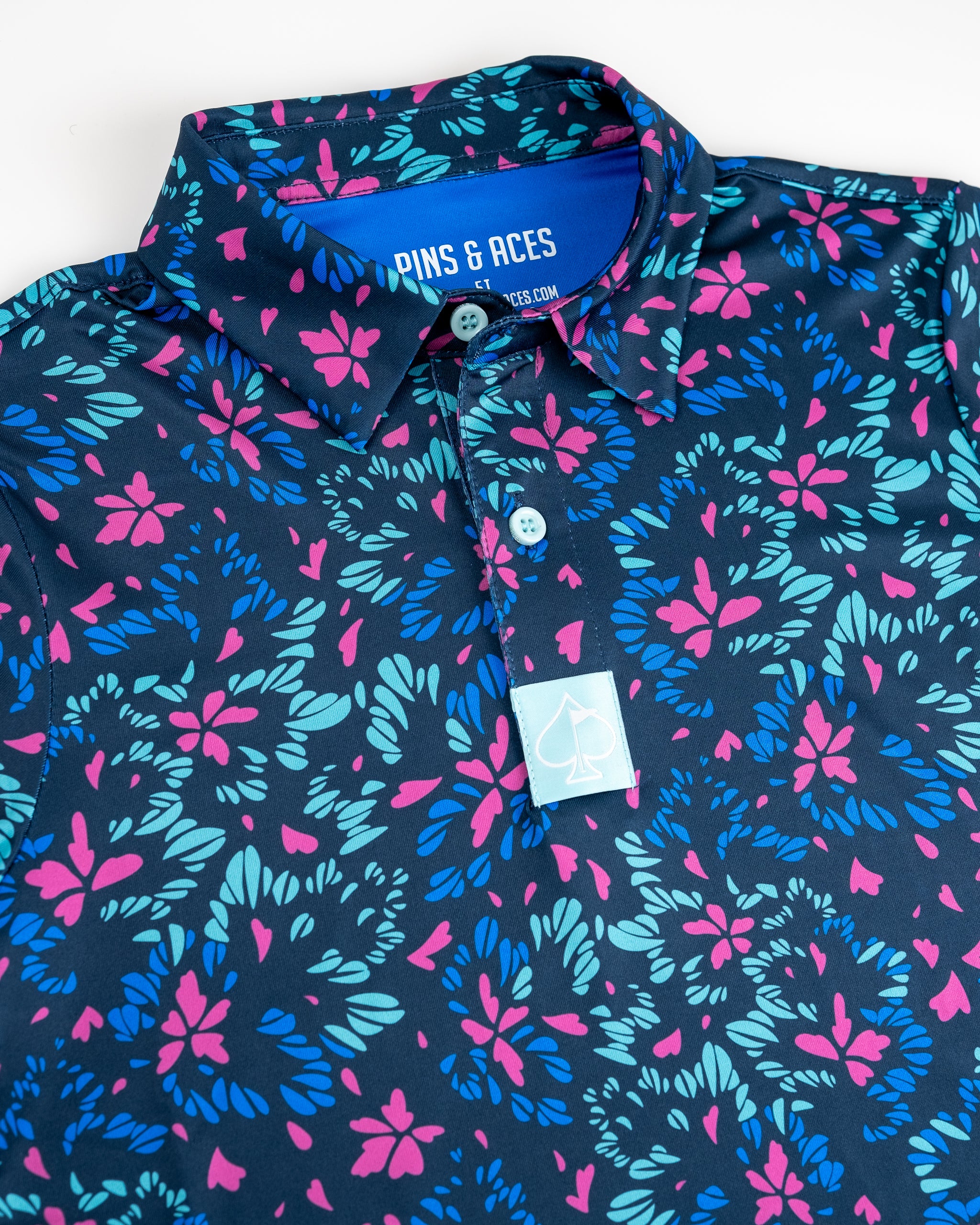 Youth fluorescent floral fabric featuring vibrant colors and a tropical bird pattern.