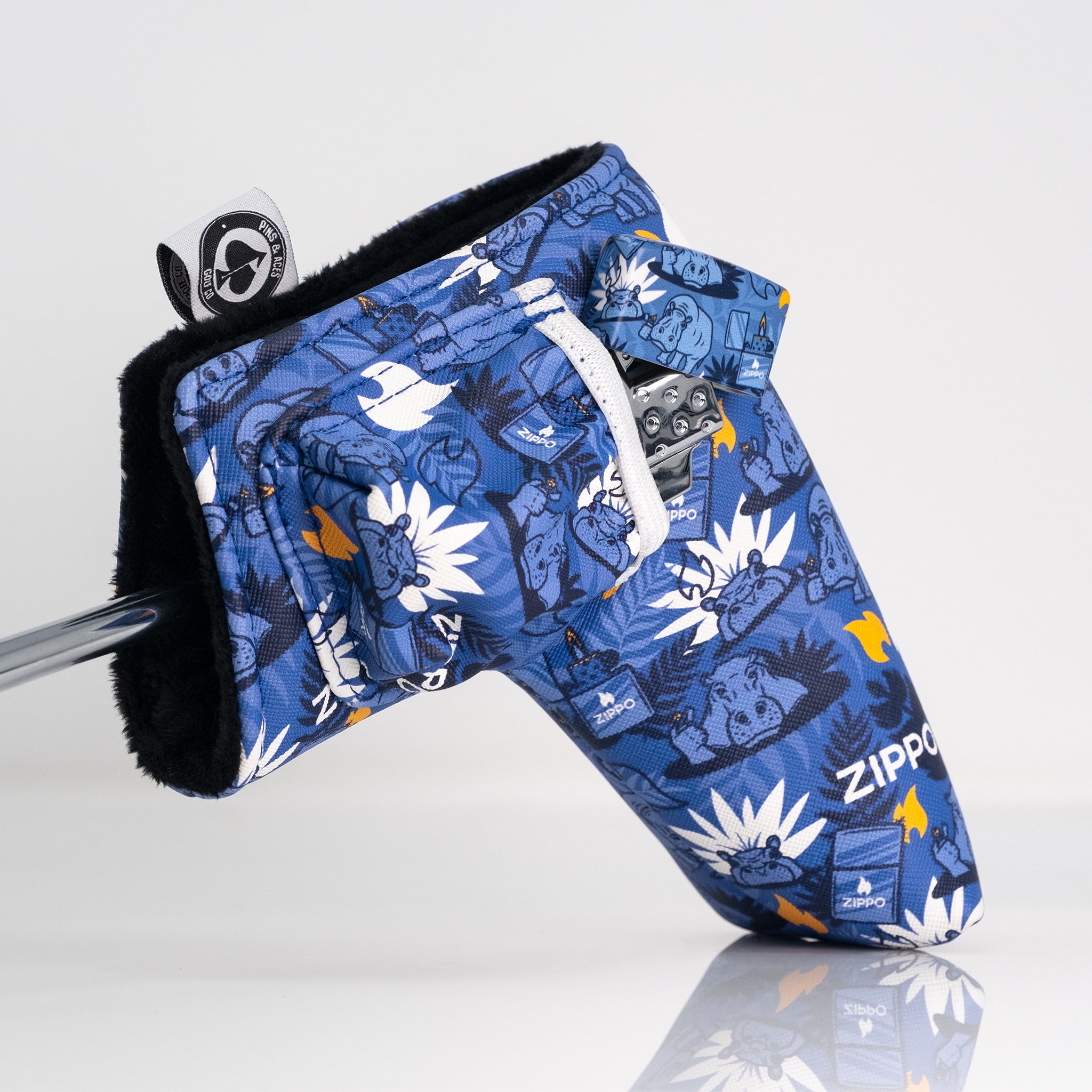 Colorful blue golf headcover with playful animal and floral print, designed to make a bold statement on the course.