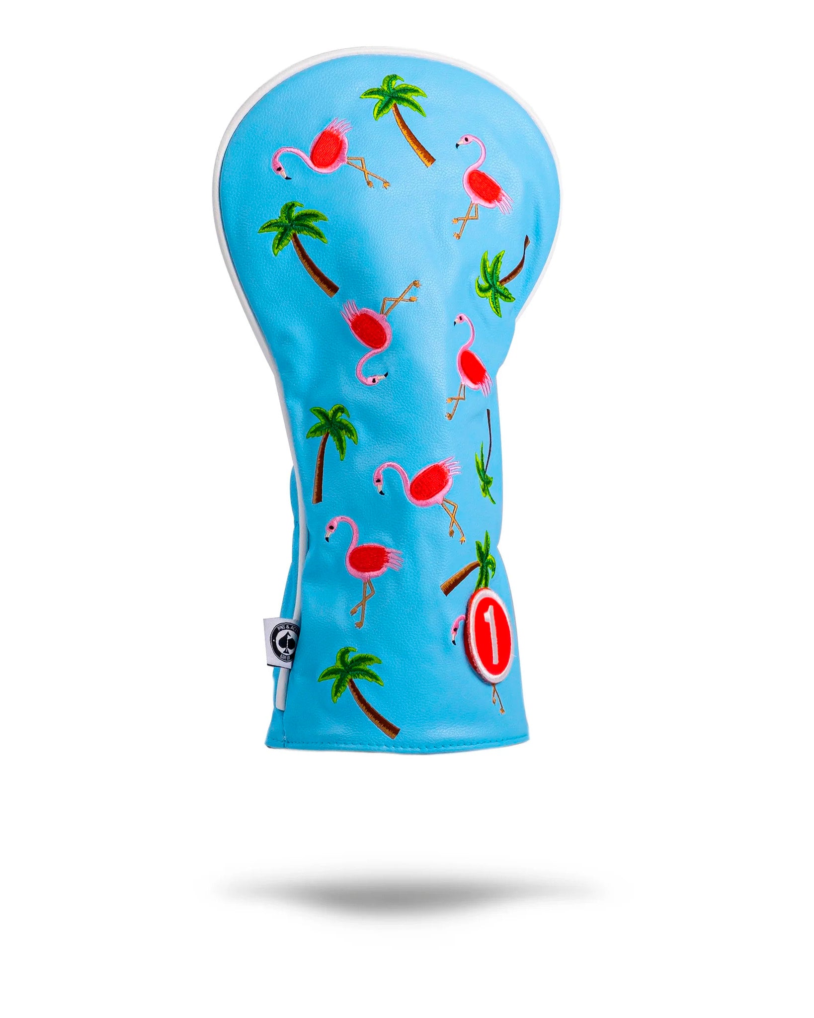 Pink flamingo-themed driver cover for golf clubs, featuring a playful design with dancing flamingos against a vibrant background.