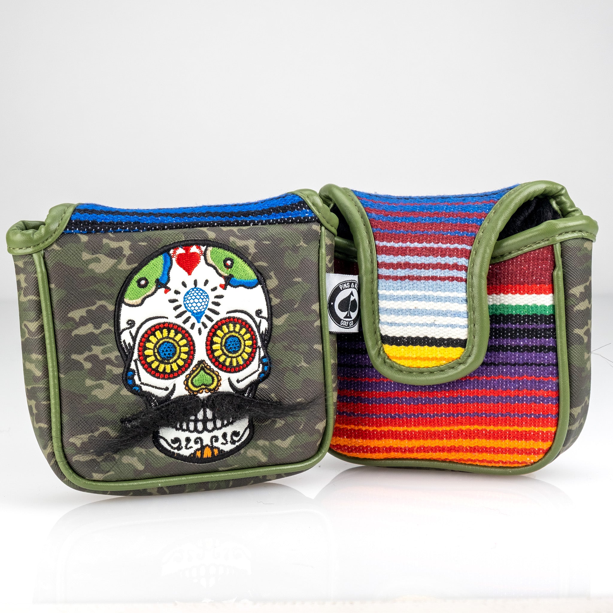 Mustache Sugar Skull mallet putter cover in green camo pattern.