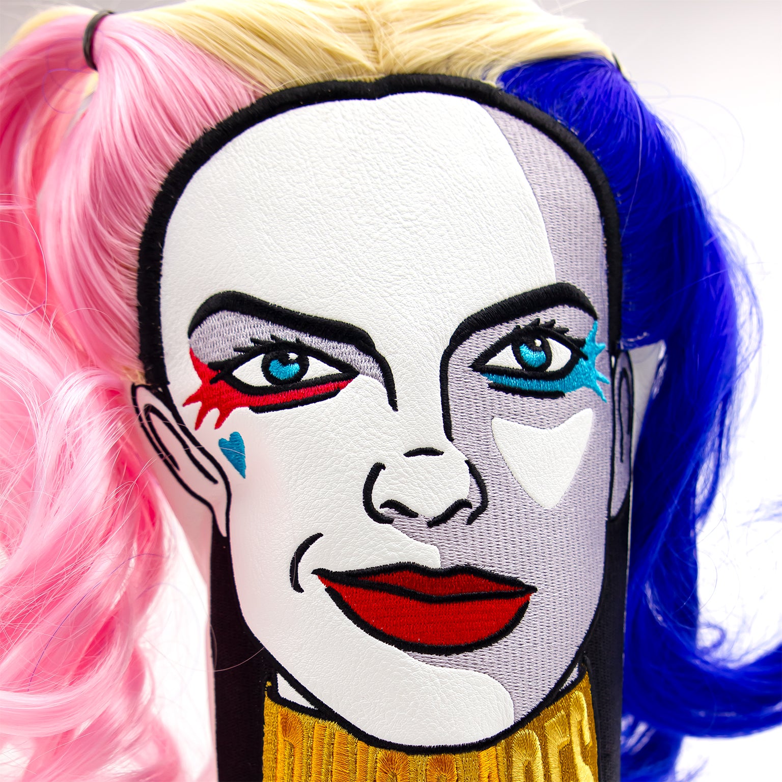 Harley Quinn-themed driver cover with a detailed face design.