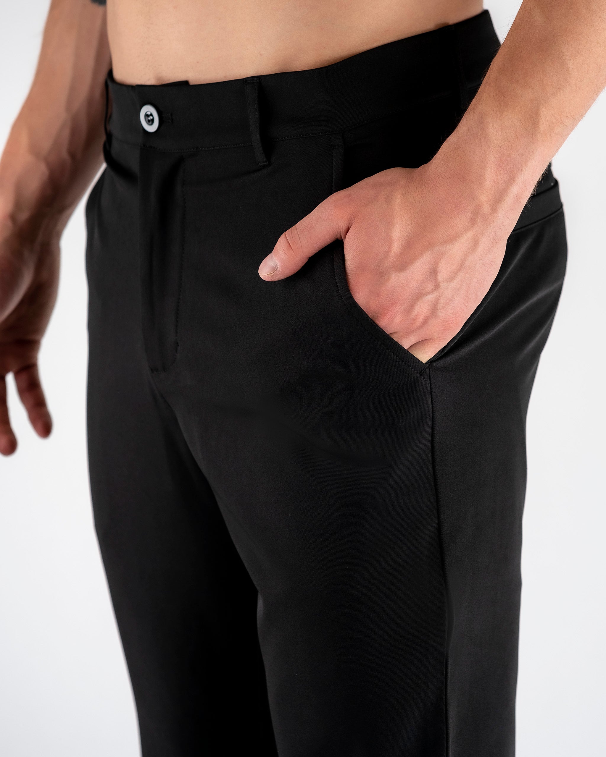 Black performance jogger featuring a sleek design, elastic waistband, and tapered legs. Ideal for workouts or casual wear.
