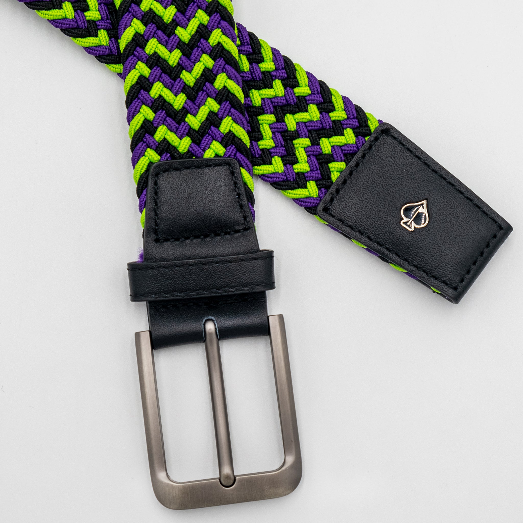 Alt text: Joker-themed pins belt featuring vibrant colors and playful designs on a black canvas.