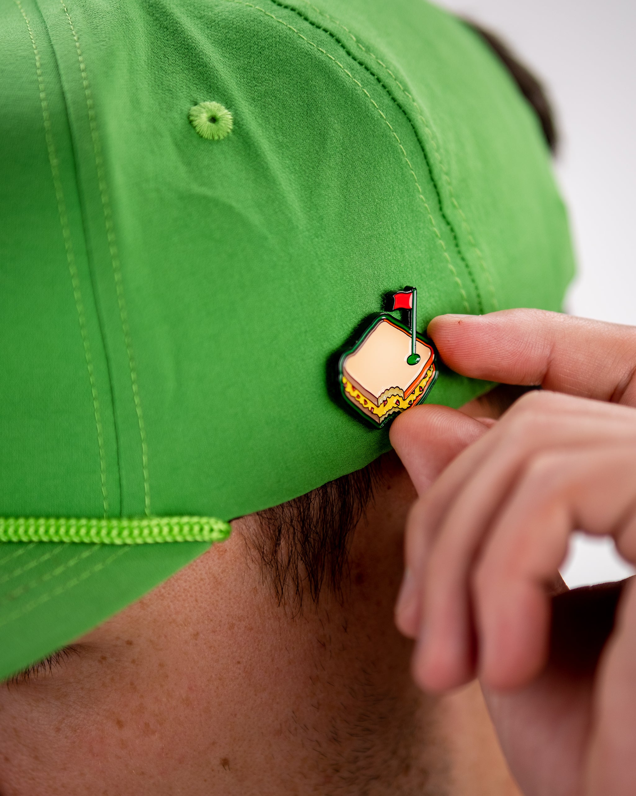 Pimento cheese sandwich ball marker with a vibrant design, featuring a cheese slice and bread illustration.