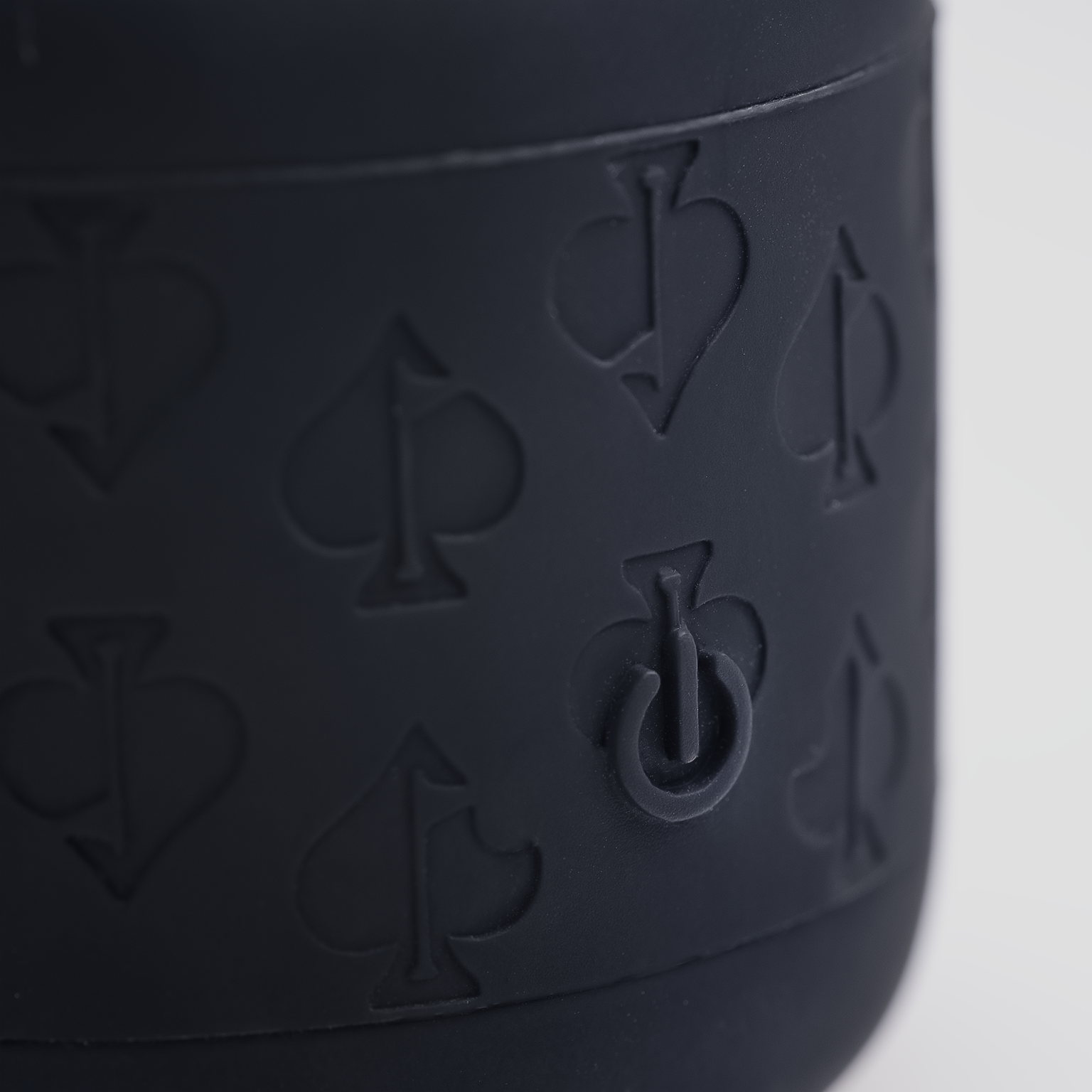 Alt text: Close-up of the power button on The Spade Speaker, featuring a sleek design and modern aesthetic.
