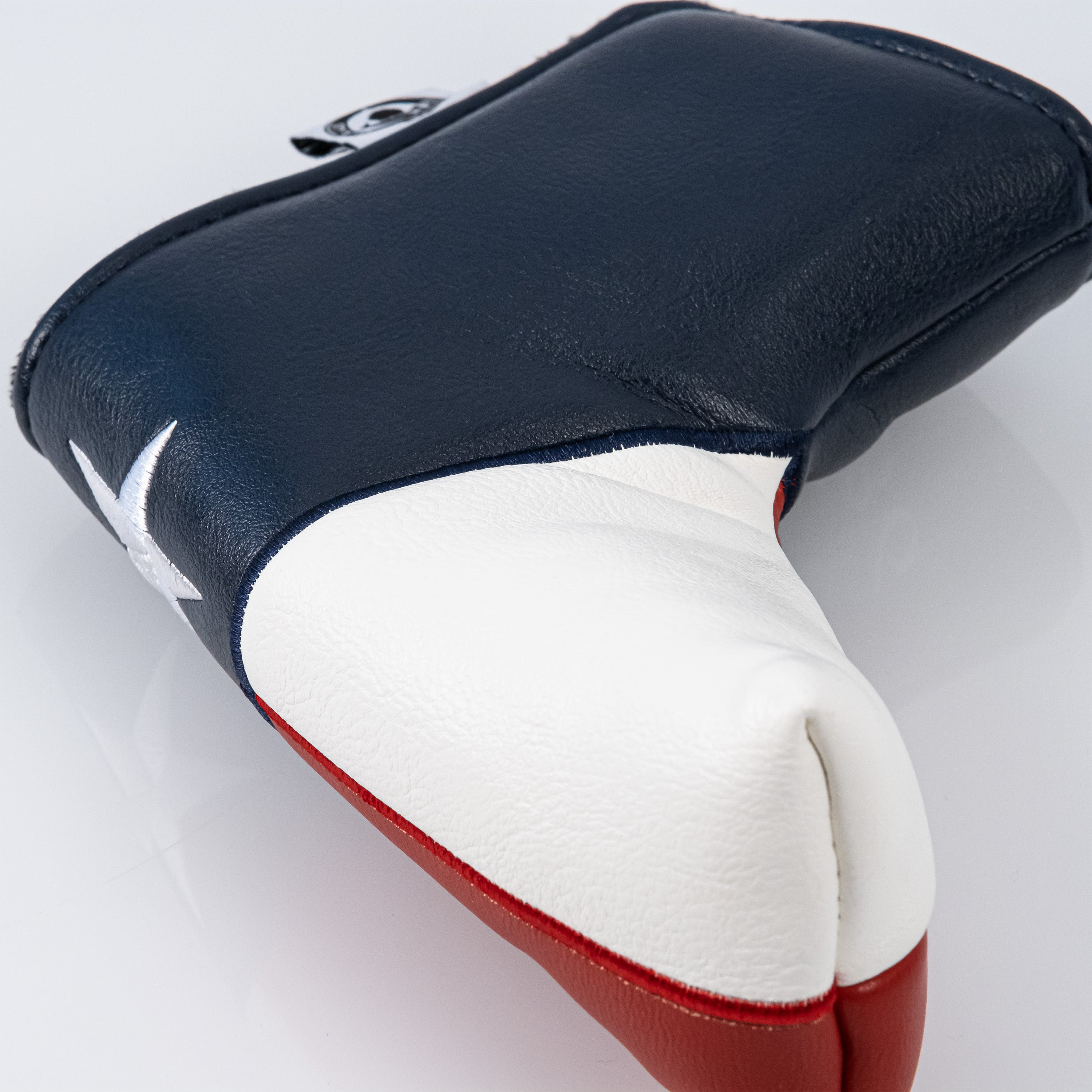 Texas Lone Star blade putter cover featuring a durable design with vibrant Texas star emblem and protective padding.