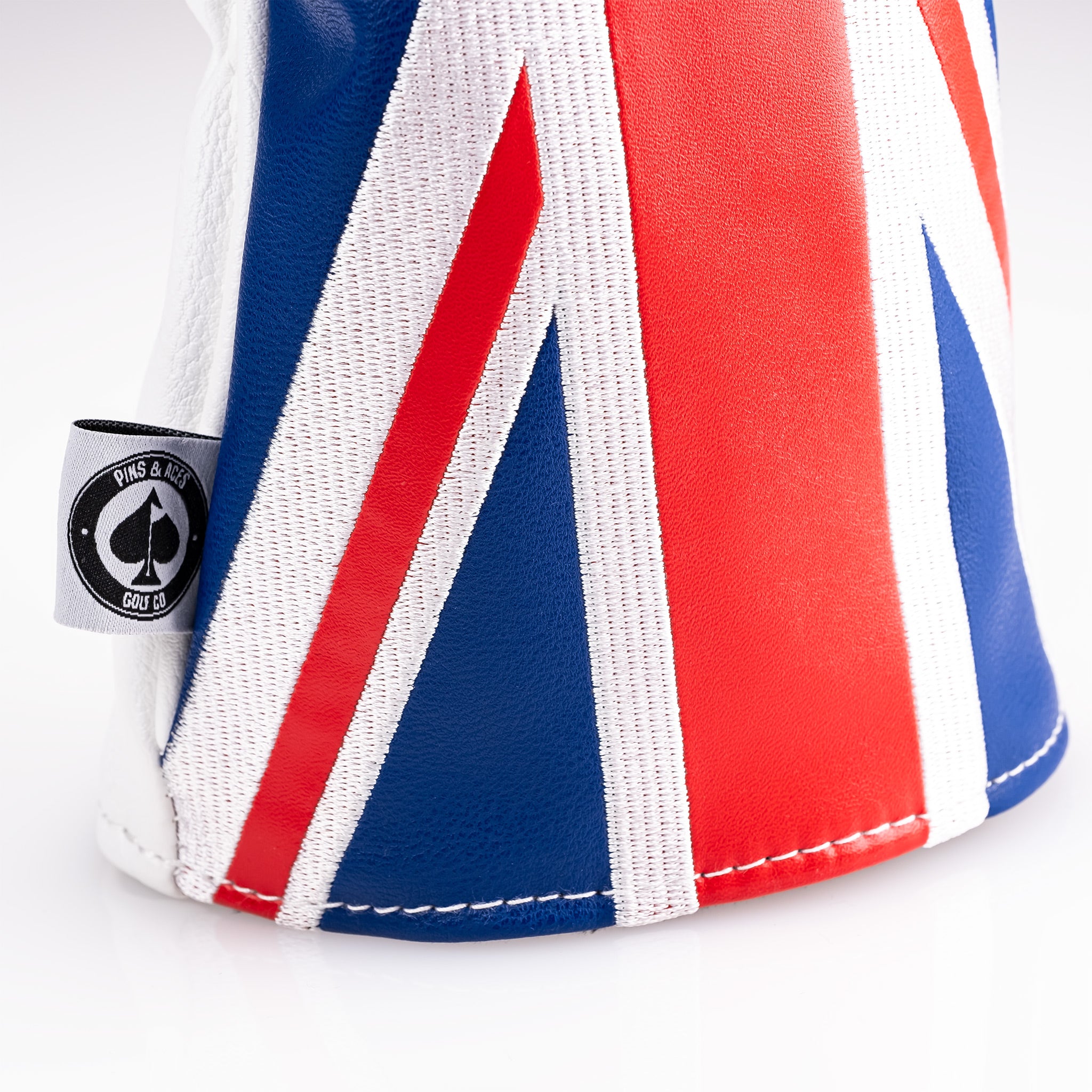 United Kingdom driver cover with bottom front detail, featuring a British flag design and premium fabric.
