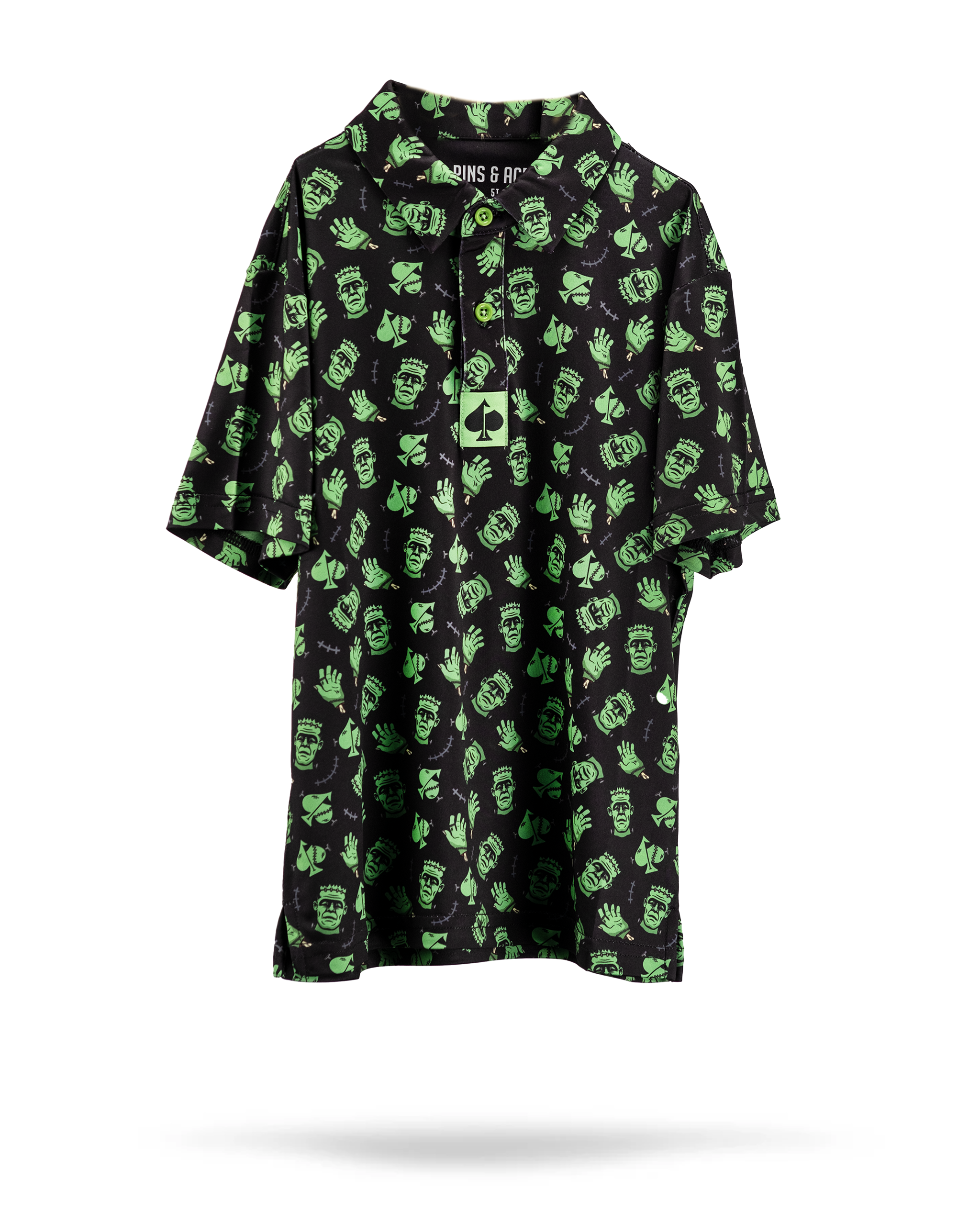 Youth Frankenstein Polo featuring a green Frankenstein graphic on the front, short sleeves, and a classic collar, set against a white background.