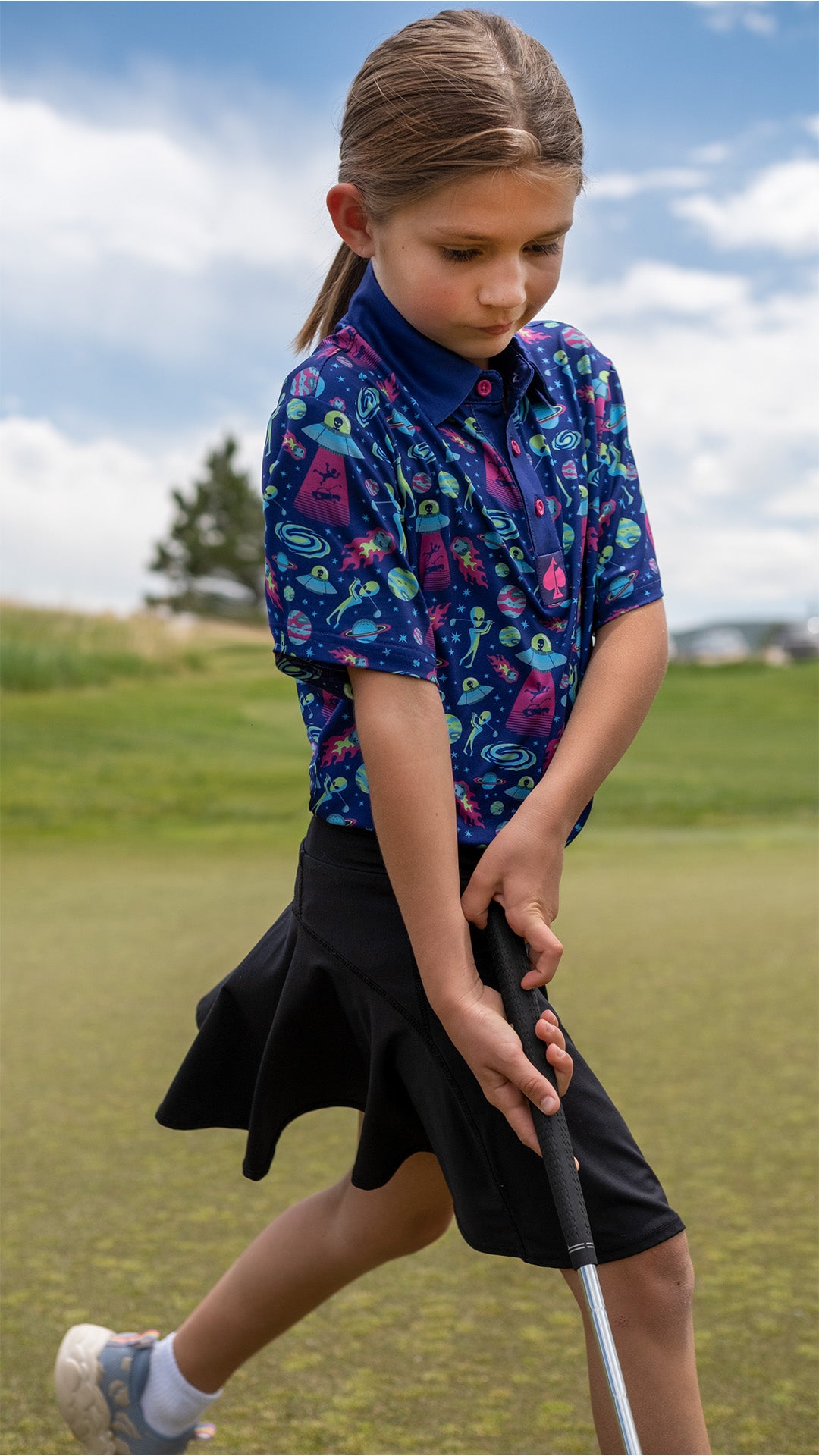 Youth Alien Invasion Polo featuring colorful alien graphics and a comfortable fit, perfect for playful outings.