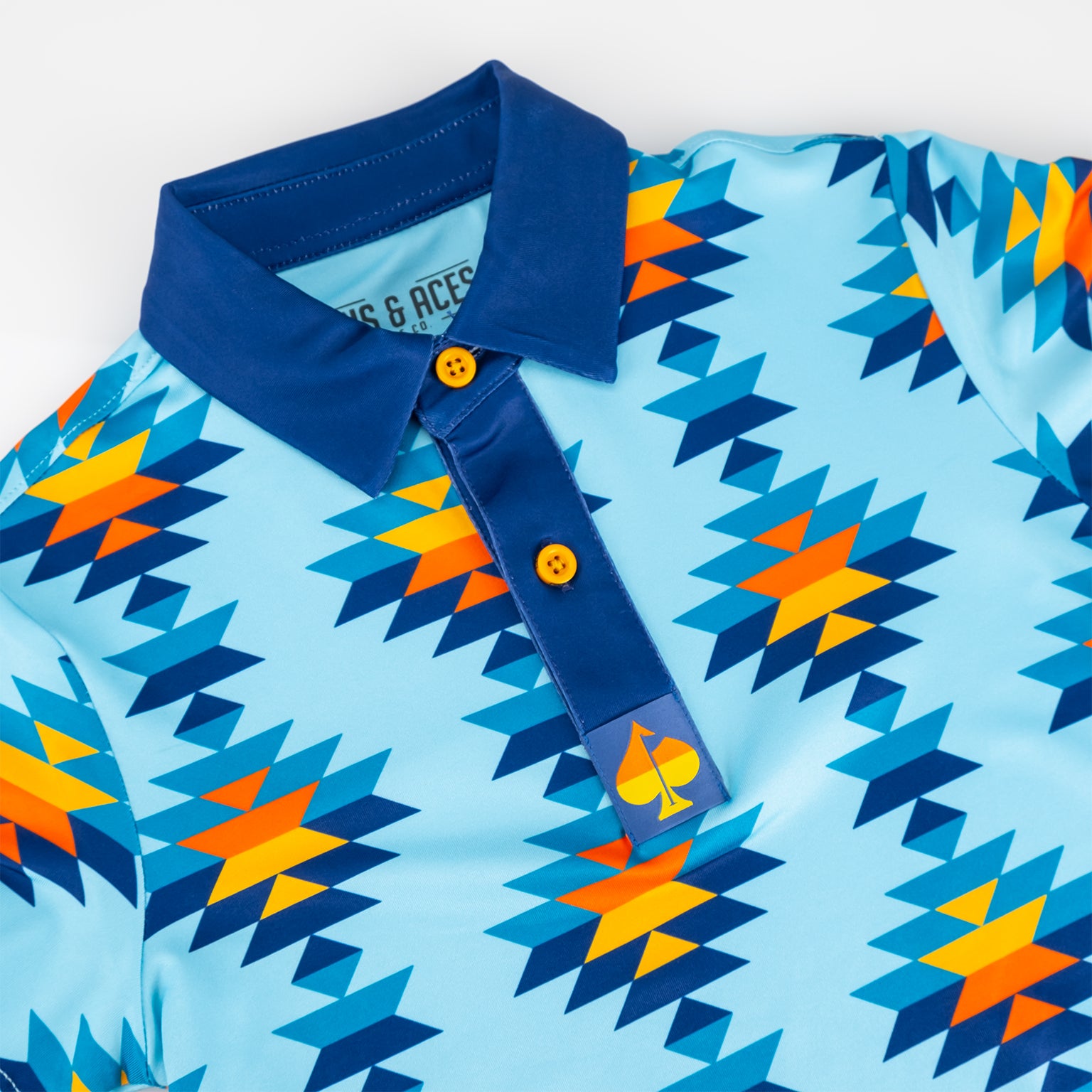 Alt text: Youth Southwest Sunset Polo featuring a vibrant sunset color scheme with a detailed collar design.