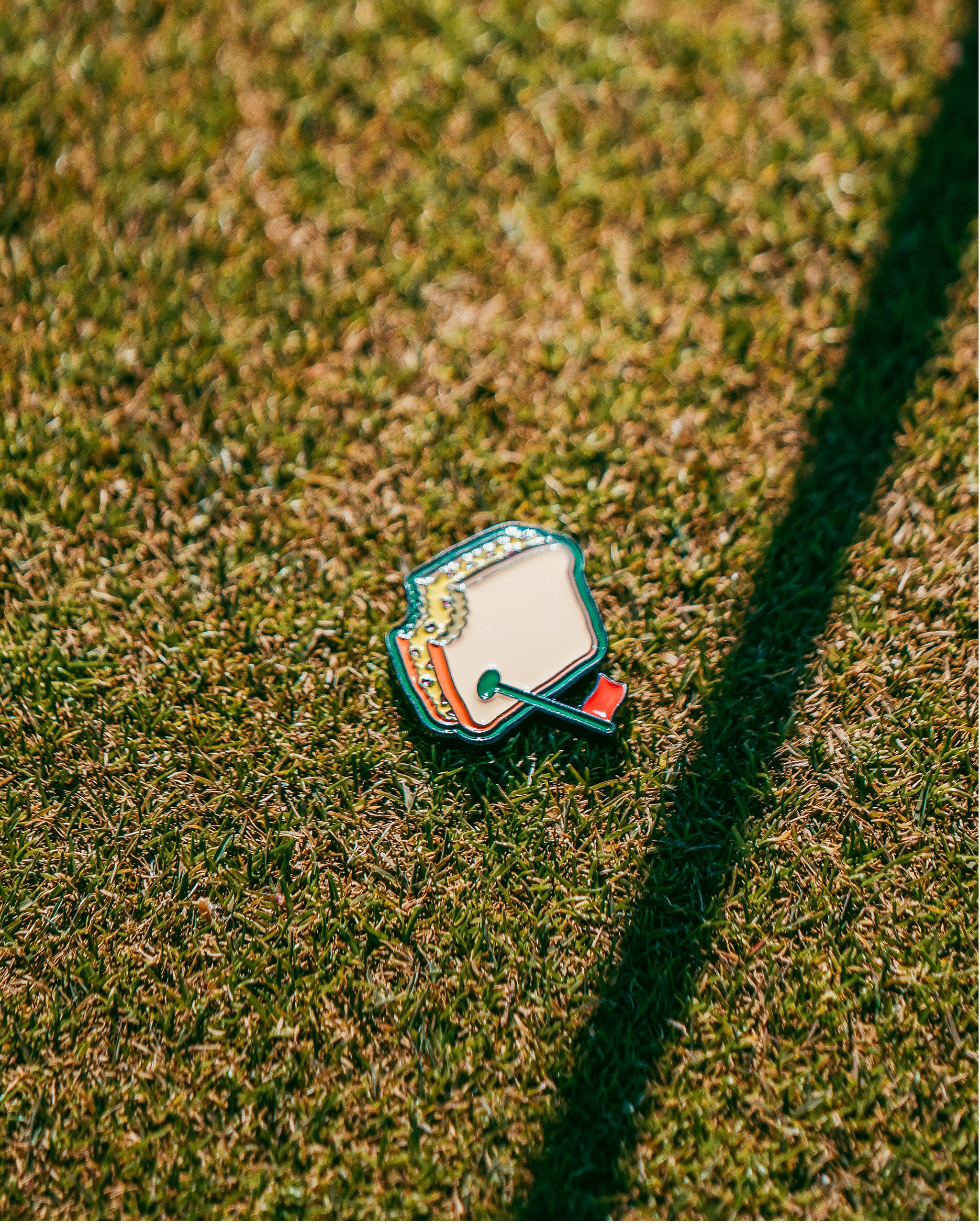 Pimento cheese sandwich ball marker with a vibrant design, perfect for golf accessories.