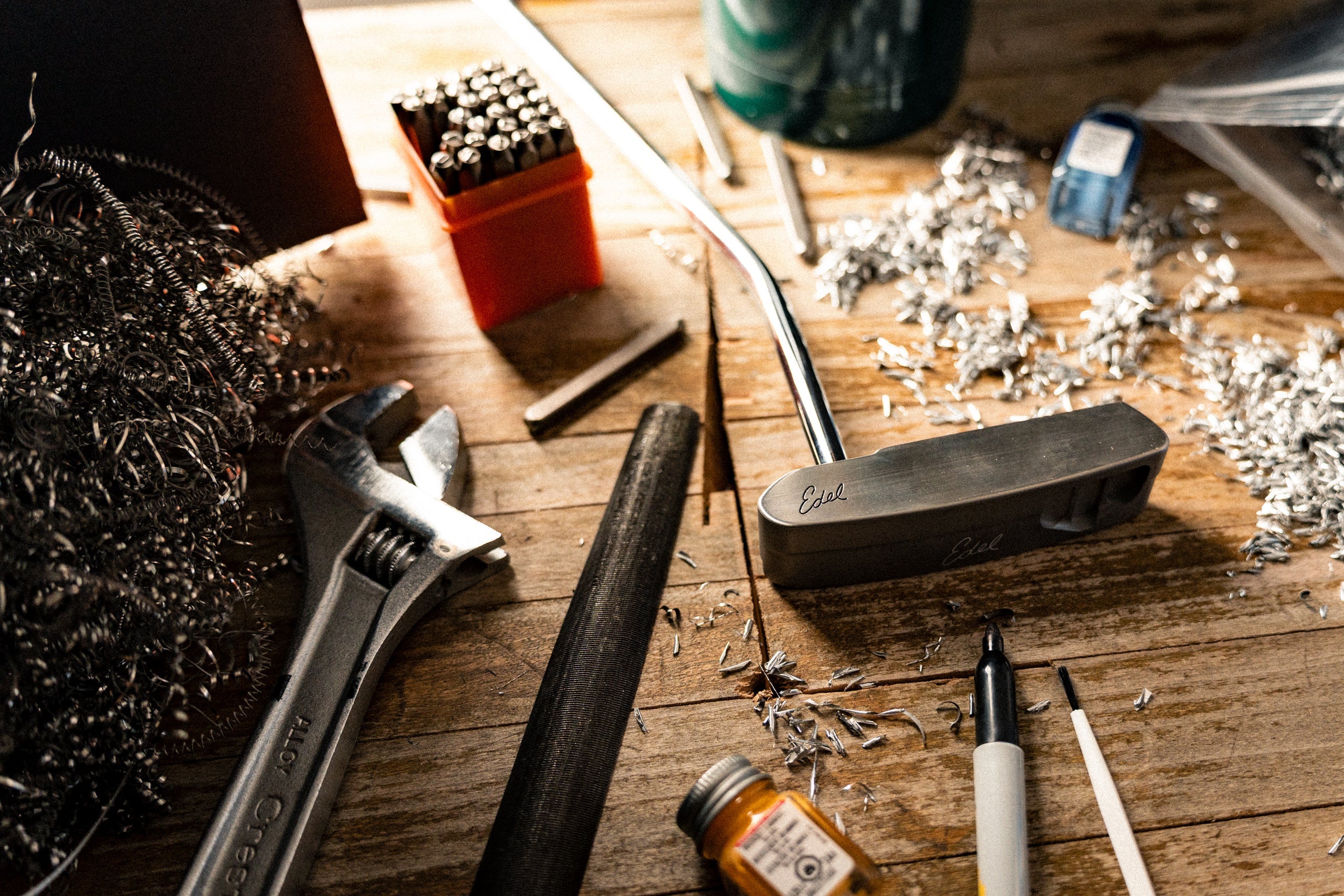 Edel Golf putter workbench with precision-milled putter heads