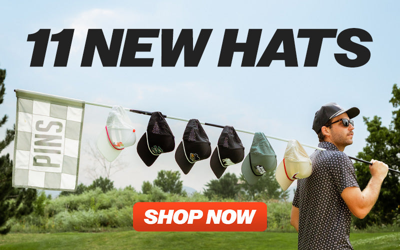 Perforated rope hat in mallard color displayed among various hats on a golf course, promoting new hat collection.