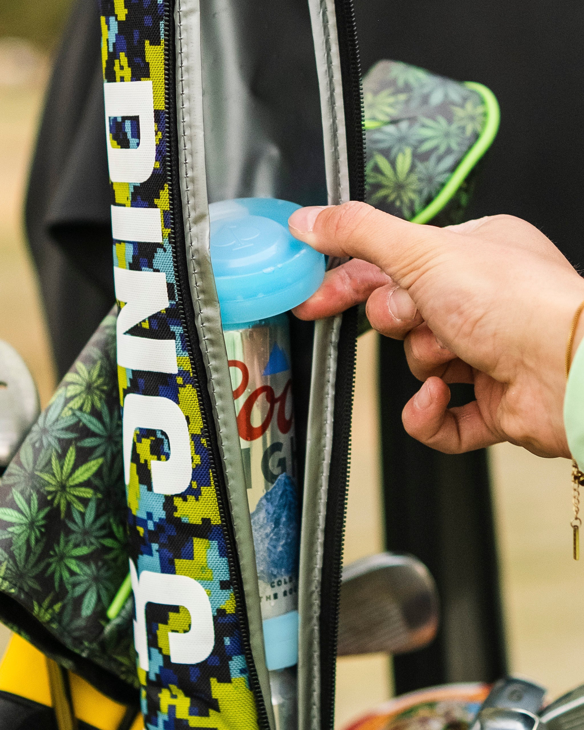 Beer Sleeve Ice Pucks keep drinks cold on the golf course, fitting securely in a golf bag for easy access.