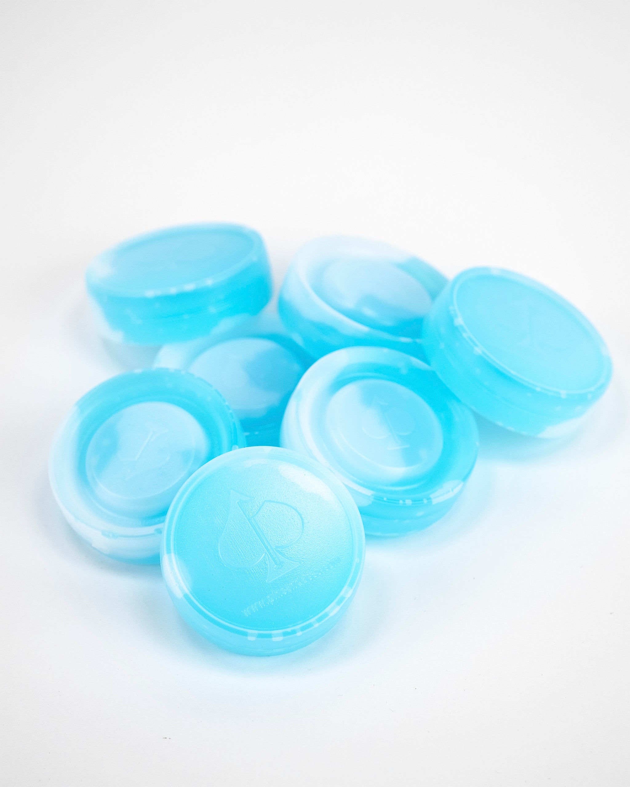 Blue beer sleeve ice pucks stacked together, designed to keep beverages cold on the golf course.