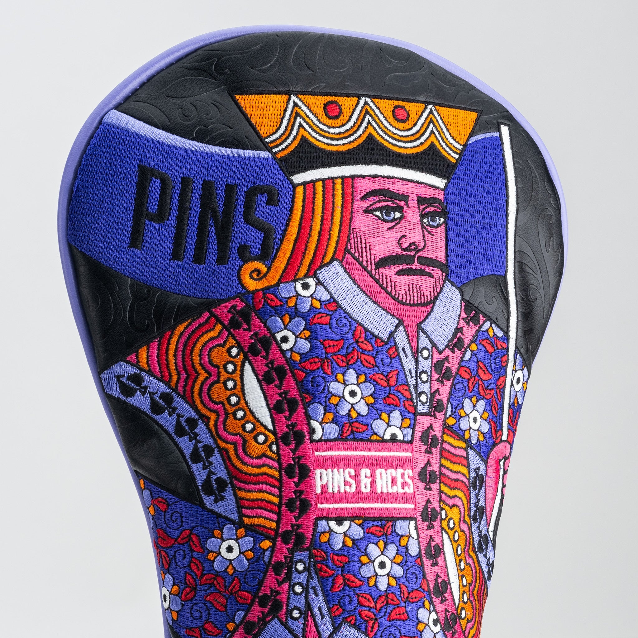 Colorful driver cover featuring a detailed King of Spades design with floral patterns and the word "PINS" prominently displayed.