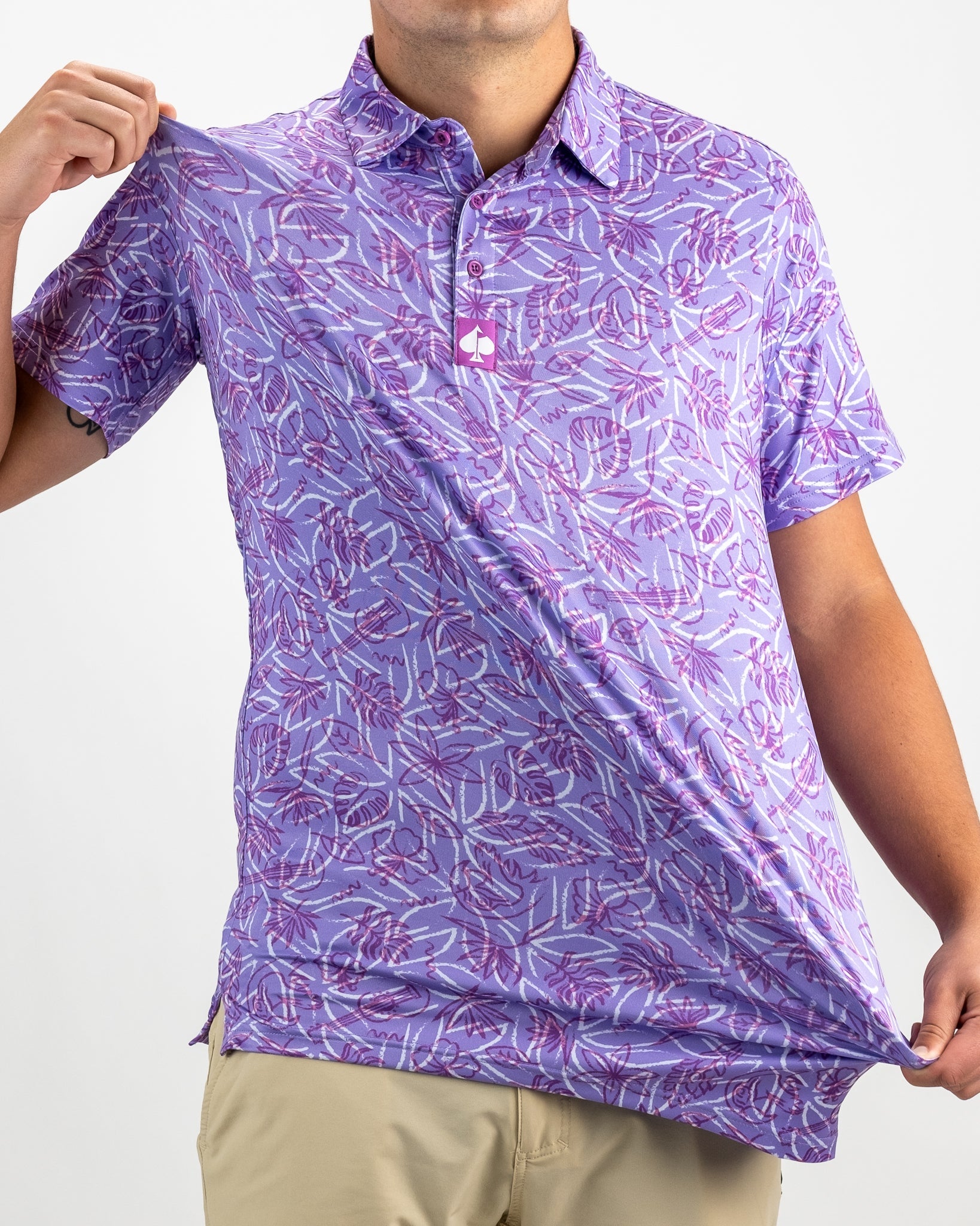 Men's Margaritaville 5 O'Clock Sunset golf shirt featuring a vibrant purple tropical leaf pattern, perfect for stylish play.