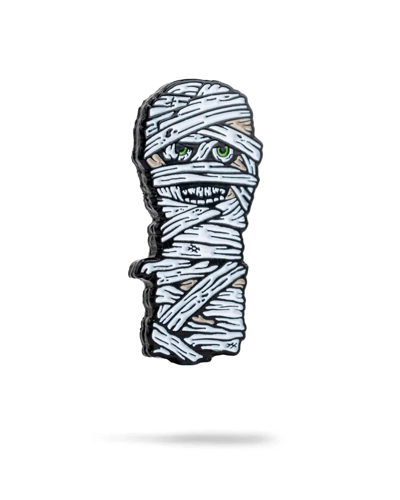 Mummy ball marker featuring a wrapped mummy design with green eyes, perfect for adding a spooky touch to your golf game.